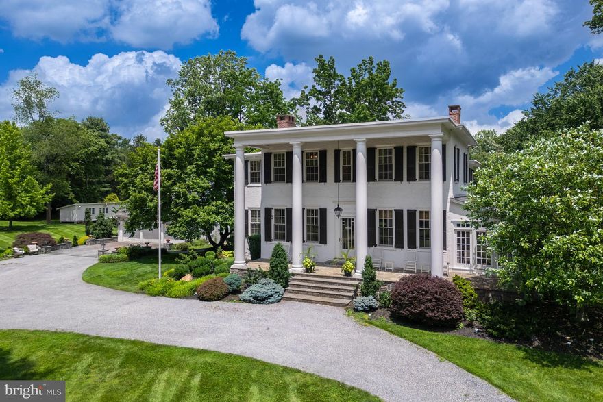 Beautiful, impeccable, completely restored and modernized estate home with jaw dropping appeal situated on 5.3 acres+ of complete serenity. This unique property includes 3.3 flat usable acres with the main house, plus an additional 1.9-acre parcel that you could build on or sell as land via proper approvals. Winner of the West Whiteland Award in 2014, there is nothing like this property in West Chester, offering stunning resort grounds, history, modern living, public water and sewer and location all in one! With a modernized and updated kitchen, this 5 bedroom, 3.5 bath home includes a detached in-law suite above the garage which adds 1 more bedroom plus a full bathroom, kitchen, and lounge area - perfect for family visiting, or it can be utilized as a very rentable space! The long wrap around driveway creates a stately grand entrance featuring a huge covered front porch and large pillars. Inside, the list of distinctive features is seemingly endless with a grand foyer entrance, gleaming, spotless hardwood floors, beautiful crown molding, wainscoting, 9-inch baseboards throughout the entire home, 2 marble gas fireplaces, beautiful built-ins, Pella windows throughout, upgraded electric and plumbing, and state-of-the art appliances including a newly added ice machine. A sunroom addition with floor to ceiling windows is a true retreat with fabulous views, and you can step out to the side slate patio where the grounds include a new firepit, 2 golf greens and unprecedented resort living. What a rare gem to find such a sophisticated retreat that is still so close to everything! 1 mile from Rte 202 and Rte 100, a few miles from the turnpike or downtown West Chester! Dating back to the early 1800’s, this home was used as the former Anne Cressons Boarding School for Girls, and has had only 4 owners in the last 100 years. This is a unique opportunity to become the next steward of a very special place. A home that truly deserves a personal visit – request your appointment today!