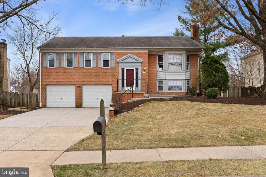 In pristine condition -Tiled Entry,  gleaming  3/4"  Hardwood flooring throughout, Kitchen remodeled featuring 42" custom white cabinets,  glass tiled subway backsplash, SS appliances,  quarts counter tops, 6ft island,  5 burner gas cooking, recessed lighting in Kitchen and Dining area.  SGD leading to Deck.  Updated Light fixtures.  New double hung vinyl windows. Custom shades throughout.  Bay window in Living Room and Family Room.  Gas Fireplace.
Laundry Room w/slip sink and washer and dryer. Owners Bathroom w/walk in shower.  Level, fenced yard. Oversized 2 car garage w/openers (room for work area).  AC in 2020, Furnace in 2021.  Professionally painted. Brick paved patio.  Sidewalks, street lights,  10 min to the blue line;  new Inova hospital, Belvoir. Pool membership available.