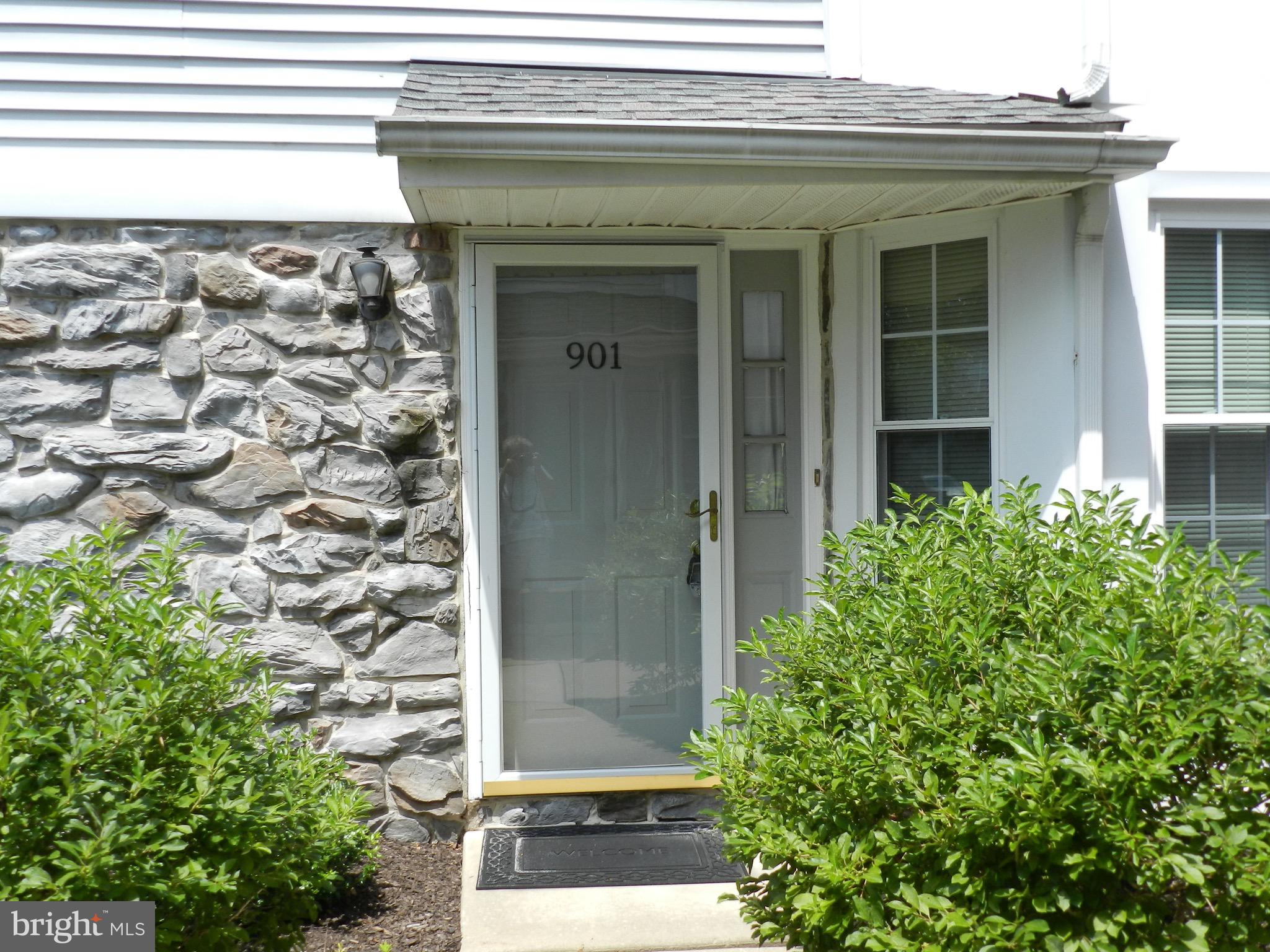 Easy living on the first floor with two bedrooms and one bath. A living room with fireplace. Home is natural color throughout, wall to wall carpet, and central air. Sliding door to patio and storage unit. Quick settlement possible.