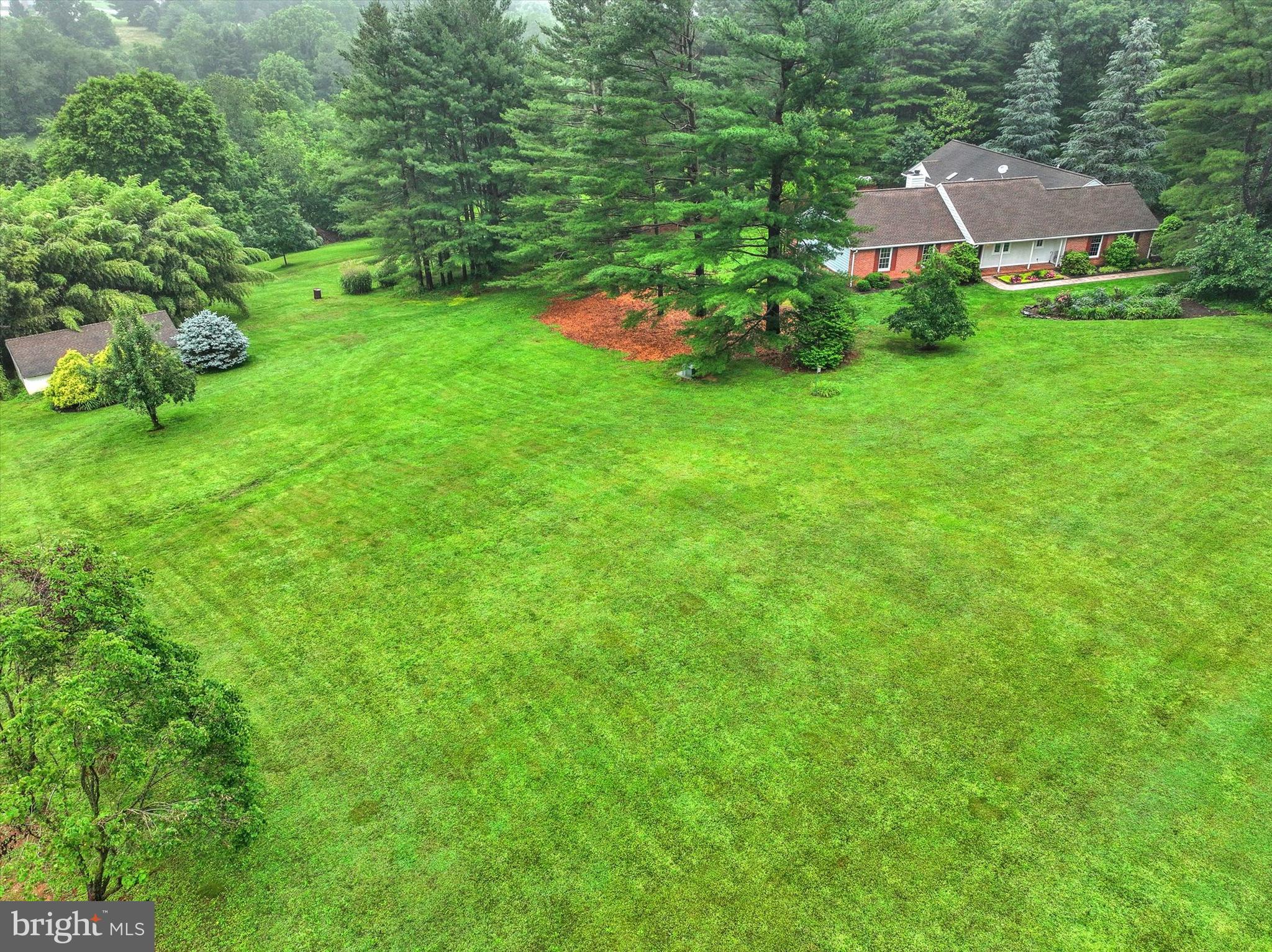 Nestled on a sprawling 9.02-acre lot in a serene rural setting, this charming ranch-style home offers a perfect blend of comfort and functionality. Located just 4 miles and 6 minutes from exit 36 in Maryland Line. With a major renovation completed in 2005,the property boasts 2,881 sq. ft. of thoughtfully designed living space, ideal for those seeking a peaceful retreat. Step inside to discover a spacious interior featuring 4 bedrooms and 3.5 bathrooms, including 2 Primary suites with ensuite bathrooms, thoughtfully designed to accommodate both relaxation and entertainment. The heart of the home is the eat-in kitchen, equipped with stainless steel appliances, including a built-in microwave, gas range, and dishwasher, making meal preparation a delight. The adjoining dining area flows seamlessly into the living spaces, enhanced by crown moldings and cozy ceiling fans that create a warm ambiance. The primary suite is a true sanctuary, complete with a luxurious bathroom featuring a jetted tub and a walk-in shower, perfect for unwinding after a long day. Additional highlights include built-ins for ample storage, a sauna for relaxation, and a convenient main-floor laundry area. The partially finished basement offers endless possibilities, whether you envision a game room, home gym, or additional living space. With three fireplaces throughout the home, you can enjoy the comforting glow of a fire during chilly evenings. Step outside to embrace the beauty of nature with panoramic views of pastures, trees, and a gentle creek. The outdoor space is equally impressive, featuring expansive decks and patios that invite you to enjoy morning coffee or evening gatherings. For equestrian enthusiasts, the property is horse-friendly, complete with a barn/stable, allowing you to indulge your passion for horses right at home. Parking is a breeze with an attached side-entry garage and ample driveway space for guests. The property is conveniently located, providing a peaceful escape while still being within reach of local amenities. This home is not just a place to live; it’s a lifestyle. Experience the tranquility of rural living combined with modern comforts and horse amenities, making it the perfect haven for those who appreciate the beauty of nature and the joys of home. This property is not just a house; it’s a place to create lasting memories.
(The deer in picture #62 and 63 are real not AI. They will be your neighbors.)