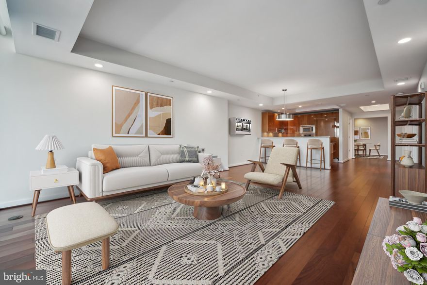 Unparalleled luxury living at Turnberry Tower! Experience refined living in this stunning two-bedroom, two-bathroom condominium.
With panoramic views of the Potomac River and Washington, DC, this residence combines sleek modern design, sophisticated finishes, and unparalleled amenities for the ultimate urban retreat. Upon entering via a private elevator, you’ll be greeted by expansive living spaces with Brazilian cherry wood flooring throughout. Additional boxes of matching flooring will remain with the unit, ensuring a perfect finish for years to come. The floor-to-ceiling windows flood the home with natural light, while automatic blackout shades and curtains in the primary bedroom provide privacy and comfort.
The gourmet kitchen is a chef’s dream, featuring custom-built Snaidero cabinetry and the finest appliances by Miele and Sub-Zero. Custom recessed lighting and chandeliers (which convey the unit) add a touch of elegance to every corner. A spacious private balcony with brand-new tile is a perfect space to unwind while soaking in breathtaking views. Additional boxes of balcony tile will also be left with the unit, offering an additional layer of peace of mind. 
The primary suite is a luxurious sanctuary, complete with a spa-inspired ensuite bathroom boasting dual sinks, a soaking tub, and a frameless glass rain shower. The additional bedroom and bathroom provide versatility and comfort, making this residence ideal for entertaining or relaxing in style.
Valet parking guarantees two spaces, while amenities cater to every need, including a heated swimming pool and hot tub, a private theater room, a party room for entertaining, a yoga/pilates workout studio, and a state-of-the-art fitness center with personal trainers and spa services available. 
Residents also enjoy 24-hour front desk concierge , valet services for both residents and guests, as well as professional security personnel. There are 10 electric vehicle charging stations - charging stations are cost free but are first come first serve. Gas, water, cable, internet, and valet parking are all included for unparalleled convenience.
Situated steps from the Rosslyn Metro and just minutes from Georgetown, this residence places you at the heart of vibrant city living. Whether you're indulging in fine dining, exploring boutique shops, or enjoying cultural landmarks, Turnberry Tower offers the perfect balance of luxury and accessibility. 
Don’t miss this unique opportunity to own a premier residence in one of the area’s most sought-after communities. Schedule a private showing today!