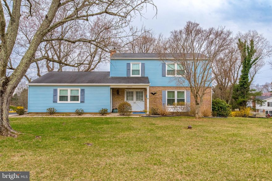 Rare Opportunity to live in Hammond Village on a quiet street walking distance to exceptional public schools, hiking trails and community pool. This well Loved/maintained spacious 4 bedrooms, 2.5 bath Colonial with 2 car garage sits on a large, landscaped lot, a gardeners dream with many mature trees and many varieties of perennials. Large driveway to side entry true two car garage and walkway to large covered front porch with double entry doors.  Inside features a traditional floor plan and has generous rooms sizes including formal living room, separate dining room, eat in kitchen, hallway with garage entrance, powered room and laundry large family room with wood burning fireplace. Sliding glass doors lead out to the large screened in back-porch, perfect for large family gatherings. Upstairs are 4 bedrooms and 2 full baths including the primary suite with en suite bath and ample closet space. The lower level is unfinished with walk out stairs to back yard, brand new LVP flooring installed. Original Hardwood flooring in bedrooms and living/dining room are in great shape. Brand new architectural roof to be installed in the next few weeks, and HVAC was upgraded in 2020. Laurel Howard County is a commuters dream with easy access to major routes including I95, Rt. 32 and Rt. 29. Halfway between Baltimore and Washington. Shopping and dining are plentiful within minutes to Maple Lawn, Columbia and Burtonsville. This home is priced to sell! Call your agent today and set up a private tour.