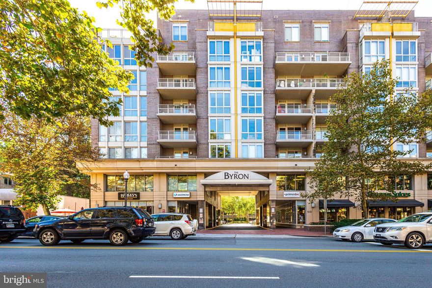 Spacious Corner Unit in The Byron – Premier Downtown Falls Church Living
Discover nearly 1,800 square feet of refined living space in this stunning corner unit at The Byron, one of Falls Church City's most sought-after luxury condominium communities. Boasting an open and airy layout, this residence features hardwood floors throughout the main living areas and plush carpeting in the bedrooms for added comfort.
The open kitchen seamlessly connects to the dining area, which is perfectly positioned for easy entertaining. Beyond the dining space, the expansive living room features two walls of windows that flood the space with natural light, along with an electric fireplace for added warmth and ambiance. Two generously sized bedrooms include en-suite baths and large walk-in closets, while a separate den offers flexibility as a home office or additional living space. A convenient half bath for guests, a laundry room, and two private balconies further enhance this home’s appeal.
Enjoy the convenience of two assigned garage parking spaces and a separate storage room. The Byron offers exceptional amenities, including a fitness center, community rooms, and ample guest parking. Ideally located in downtown Falls Church City, this home is just steps from shops, restaurants, and everything this vibrant neighborhood has to offer.