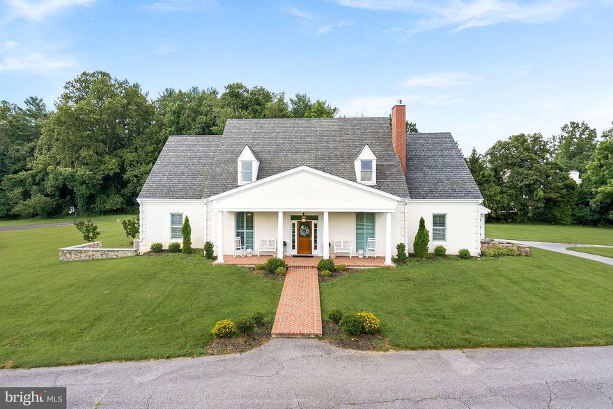 Nestled on over 13 acres of rolling lawn in Sandy Spring, 1301 Hennessy Terrace is a rare blend of timeless architecture, refined interiors, and exceptional grounds. With more than 5,000 finished square feet and 12,000+ square feet including outbuildings, this residence is designed for both gracious entertaining and comfortable everyday living. This home comes with potential for 2 additional buildable lots zoned R2, subject to county approval!

A long, sweeping drive leads you past white-fenced fields to a stately front façade with classic symmetry, brick walkway, and columned porch. From the moment you arrive, the home exudes warmth and elegance, perfectly balanced by the privacy of its expansive grounds.

Inside, the foyer opens to a sophisticated living room with rich blue walls, perfect as a music, sitting room or future office and a formal dining room bathed in light from plantation-shuttered windows. The heart of the home is the family room, where a stone fireplace, custom built-ins, and French doors invite both intimate evenings and lively gatherings. The gourmet kitchen shines with white cabinetry, quartz counters, a large center island, and striking gold lantern pendants. A sunny breakfast area overlooks the lawn, while a butler’s pantry and wine nook add touches of convenience.The main-level primary suite offers a true retreat, complete with fireplace, spa-style bath, and a walk-in closet.

Upstairs, find five additional bedrooms and three full bathrooms — each bedroom thoughtfully designed with natural light and ample storage. A spacious bonus room serves as a media lounge or playroom, ensuring flexibility for modern living. Skylit bathrooms add charm and brightness to the second level.

The lower level is expansive and versatile with home to a future game room, family room, recreation area, gym and office with a half bathroom:

Beyond the main home, the property offers unmatched amenities, a 2,500+ sqft barn with a 2 car garage for horses, hobbies, storage and more! The yard is complemented with a basketball/tennis asphalt court, outdoor terrace featuring a lovely fireplace for those fall and winter nights and a hot tub to enjoy while you soak in your private oasis.

Located just minutes from Olney and commuter routes, this estate provides country serenity with suburban convenience. Whether it’s coffee on the porch, dinners on the covered patio, or games on the sports area, life here flows seamlessly from indoors to out.

1301 Hennessy Terrace is more than a home — it’s an estate, a retreat, and a lifestyle.

Schools: Sherwood Elementary, William Farquhar Middle and Blake High School