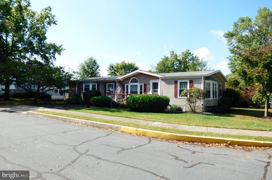 With a spacious 1,685 sq. ft. layout, it features a cozy family room off the country-style kitchen, perfect for gatherings. Enjoy the warmth of a brick fireplace and the elegance of crown moldings throughout. The exterior boasts low-maintenance vinyl siding and a lovely deck for outdoor relaxation. Situated on a corner lot, the property includes an asphalt driveway with ample parking. Residents benefit from a vibrant community atmosphere, with nearby parks and convenient access to local amenities. The Red Hill Estate neighborhood is known for its friendly spirit and well-maintained surroundings. Essential public services are just a short distance away, ensuring a fulfilling lifestyle. This home is not just a place to live; it's a place to thrive. Experience comfort and community in this delightful residence! Seller improvements: Windows, Roof, Gutters, Heat Pump, Hot Water Heater, both Deck Replaced and Stained. Be sure to view this Home before its sold!