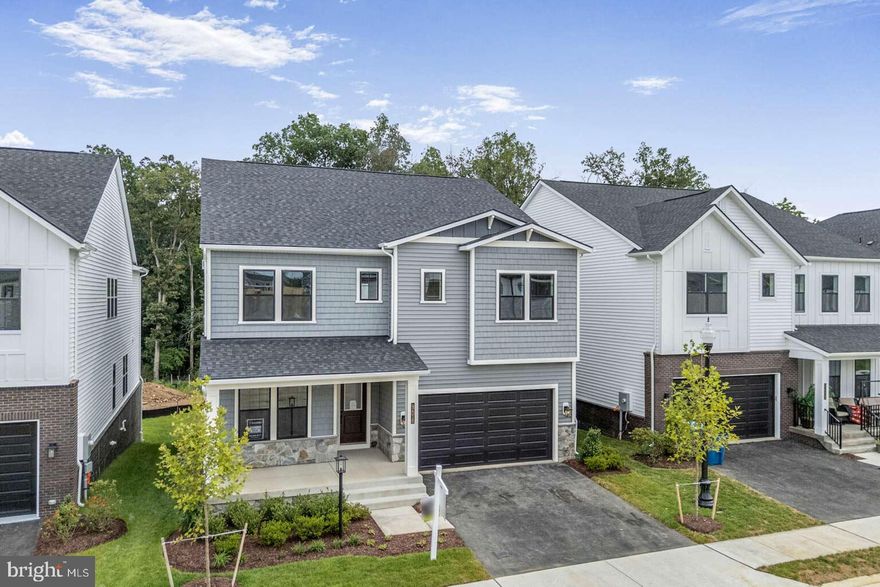 Gorgeous new home ready for quick move-in! The open main level boasts a Chef-inspired kitchen, and a large great room, and spacious dining room that opens to the covered outdoor living.  The main level also has a pocket office and a guest suite with full bath.  The kitchen is complete with an expansive island with Calacatta quartz countertops, Gunny cabinets, and stainless steel appliances.  The second floor offers a luxurious primary suite with tray ceiling and an enormous closet, and an upgraded primary bath with quartz countertops and separate soaking tub.  The second floor also has three large secondary bedrooms, a loft, and a sizeable laundry room.  A large rec room with beverage center, a bedroom, and a full bath complete the finished lower level.