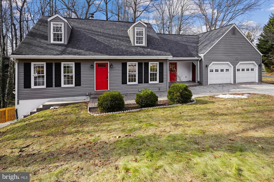 Offers due 1pm Monday, Feb 24th.  Seller will review all offers Monday afternoon and respond no later than Monday evening. Storybook charm on a half acre lot with LAKE VIEWS! Located in a sought-after cul-de-sac right around the corner from private, West Beach with it's boat launch, sandy beach for swiming and fishing and a shaded playground/picnic area with grills and basketball courts. This home offers a true lifestyle enhancement along with a BONUS SUITE in the Walkout lower level featuring a Full sized Kitchenette , Full bath with walk-in shower, the FIFTH Bedroom and a large recreation room with those views of Lake Montclair. Step inside to your freshly painted cape cod charmer! Your main level has a full home office, formal living room with one of TWO FIREPLACES and a flexible formal dining room...and in the heart of it all a lovely kitchen with granite countertops and high-end PELLA cabinetry, Wow! Rounding out the main level is a large bonus room with that second fireplace and access to the newer deck! Step upstairs and you will find your primary suite oasis with an attached huge storage room with endless potential and 3 additional bedrooms, all with fresh new cozy carpeting. Attached to your home is a two car garage with charming breezeway...Your Montclair amenities include a 109-acre stocked lake with 3 sandy beaches, boat ramp, boat storage, fishing piers, playgrounds/tot lots, ball fields, exercise stations, new dog park, 18-hole golf course with full-service Country Club, ...the list goes on!  Easy access to I-95 and nearby commuter lots/buses make it easy to commute to DC, the Pentagon, and beyond. Special financing is available through Project My Home offering reduced rates and/or closing cost support for the buyer of this property. Home is currently enrolled in a premium home warranty with the option to transfer to buyer at closing. Updates include: roof (2018), HVAC (2017), kitchen & laundry appliances (2020-2022), floors and back deck (2023).