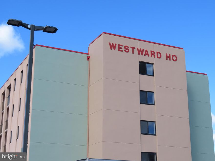 Welcome to Westward Ho bayside canal view from entire living area & bedroom in the heart of Ocean City, MD.  23rd St. Convenient location is the key here.  Hidden away from main road and hustle, bustle Walking distance of approx. 2 long blocks across St. to boardwalk, sand and beach. 1 block north of popular FISHTALES bay front bar & restaurant, 3 mini golf locations very close. 1 at end of entrance road to bldg. and 1 across street. Jolly Rogers Amusement Park just a few blocks north. From Rt. 90 turn right into Ocean City on Coastal Hwy. to driveway just before 23rd St. light and turn right into the new Embers & BLU crab house & raw bar restaurants driveway. No thru traffic.  Drive straight back toward the bay & will see the  building. If you pull around the west back end of building past that entrance & outdoor shower, in the off street  parking lot you can park in front of your canal view with boardwalk, private balcony from this 2nd floor end efficiency unit which features fully furnished, 1 bedroom and 1 bath with large shower stall. Many units in building have been made into 1 bedroom w/ a permanent wall. This unit has a new wall made from designing windows, installed 2021. It's a  sliding wall which can be left open or closed for complete separate nice sized bedroom privacy and separate living area. Mid rise 5 floor concrete/masonry building. Elevator or stairs when you enter secured locked entry door up to your 2nd floor condo. Lots of great natural lighting. Open floor plan w/eat in kitchen. Electric range/oven with range hood, fridge, microwave. Ceiling fan & central heating & A/C mini duct unit installed new 2014 has been serviced under a maintenance agreement,  Oct. 23rd prior to a sale. Condo has just recently been remodeled 2022. All new white soft close cabinets. Crown molding,  inside doors, countertops,  flooring with laminated plank, faucets, mostly all  fresh paint, new sofa and more. 4 brand new pillows, new package of sheets & pillow cases unopened for you to spend your first night. Some owners have placed 2 beds in the bedroom. Cats & dogs are allowed only if you are an owner. Dog walk area across the street also. Small picnic & grilling area overlooks canal which leads to open bay. You will receive 2 parking passes. Shared common area laundry for sellers only is on 3rd floor. Renters laundry is shared/common area on separate floor. Water consumption is included in condo fee, but fixture fees are paid by the owner. If you have your boat with you for the time you are staying at condo, there is a private boat launch ramp that there is a condo easement for allowing you to usage of the boat ramp left of west end of parking lot. Can use with showing proof that you are a Westward Ho owner and you are to receive a code per the board president. There is also a boat tie up in canal next to the boardwalk. When you leave condo you must take your boat & trailer with you as you cannot store there when you have left. Outside building and balconies are in process now of being painted and almost completed. This is a non smoking building both in units & on balconies. You must exit the building to smoke.  What a inexpensive vacation retreat or even a investment property. Not many become for sale in this building. NOTE: ALL BALCONY FLOORS ARE IN PROCESS OF BEING PAINTED. DO NOT WALK ON UNTIL FURTHER NOTICE.