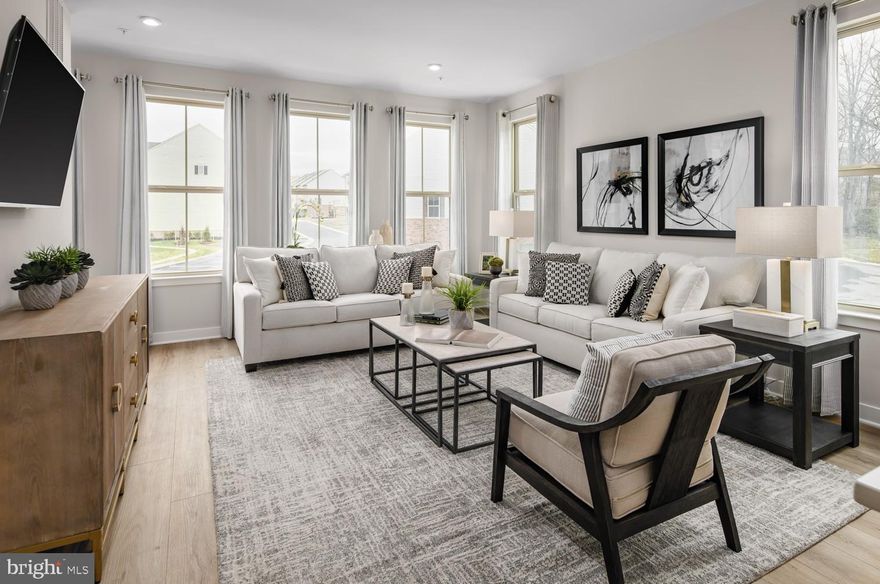 Welcome to the To-Be-Built CADENCE Floorplan at the brand new MADISON GREENS community in Ranson, WV! Luxury townhomes that live like a single family home with backyards and a prime location walkable to Potomac Towne Center and right off Rt. 9. Only 20 min from Frederick County, MD and 30 min from Loudoun County, VA. Step through the welcoming foyer into an expansive recreation room, perfect for entertaining or relaxing. Want even more flexibility? Add a full bath to transform this space into a private guest suite. On the main level, experience true open-concept living. The spacious great room flows seamlessly into a gourmet kitchen featuring a large center island, walk-in pantry, and adjoining dining area — ideal for gatherings and everyday life. Upstairs, discover two secondary bedrooms and a full bath, along with your luxurious owner’s suite. Enjoy the convenience of two walk-in closets and a spa-inspired bath with dual vanities. Come visit our model home at: 1741 Destrier St, Ranson, WV, 25438