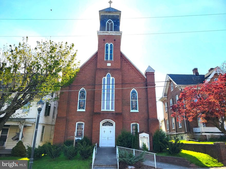 Built in 1882, this ±3,676 SF traditional brick church is located in historic downtown Union Bridge. The upper-level sanctuary offers a vaulted ceiling with ornate woodwork, beautiful stained-glass windows, carpet over hardwood floors, and pew seating for ±150.  The main level of the church features five rooms currently configured as bedrooms/living spaces, two walk-in storage rooms, 1.5 baths, laundry room with washer and dryer, as well as a spacious  ±1,350 SF multi-purpose room with full kitchen.  

Both levels of the church are heated and cooled with four new mini-split units, a new water softening system and 50 gallon water heater. All the upgrades were installed in 2021/2022. The church roof is believed to have been replaced in 2015 with new plywood and 50-year shingles. The building is served by public water and sewer. Sitting on ±0.25 acres, the property has a small rear yard and space for off-street parking for 2 to 3 vehicles. 

The property is zoned R6000, which is residential, though the building designation is commercial/ residential.  Please inquire with the town of Union Bridge with any zoning and use questions. The seller makes no representations or guarantees regarding condition, zoning, or use. Buyers should address any issues during the study period.  The property will be sold as is. To submit an LOI, please request a term sheet. This is a commercial sale. Some items in the sanctuary may convey. Some furnishings and fixtures may be purchased separately.