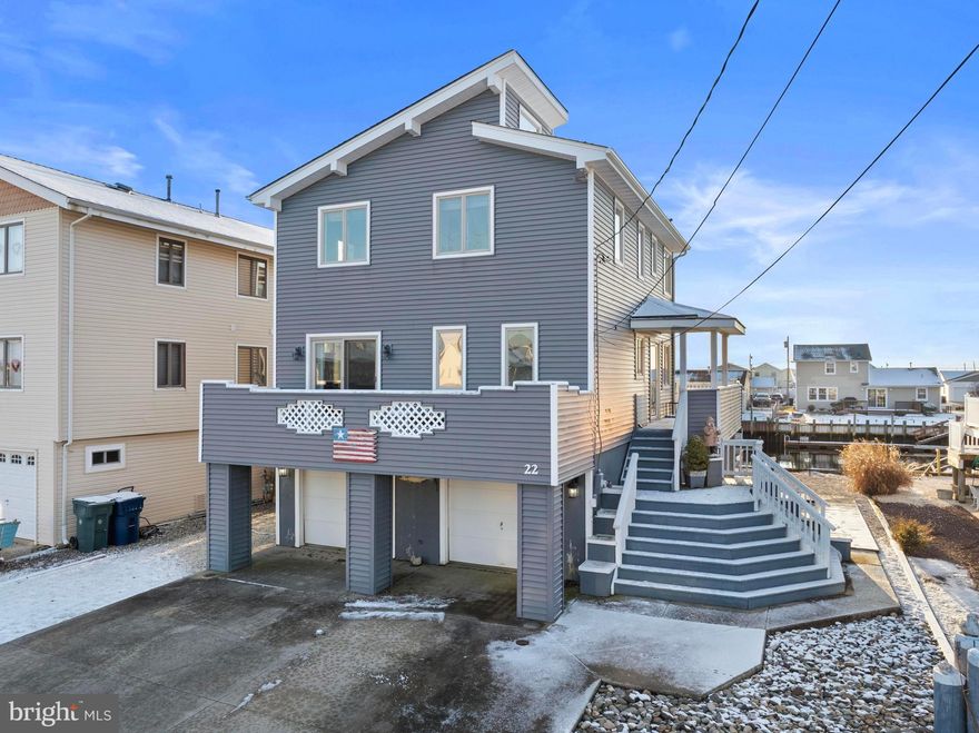 JUST REDUCED $36,000 PLUS SELLER IS OFFERING A $15,000 SELLER'S CONCESSION FOR BUYER'S CLOSING COST! Welcome to 22 S. Dayton, a contemporary 3-bedroom, 3 full-bath waterfront home offering approximately 1,400 sq. ft. of living space. Oversized sliding glass doors flood the home with natural light while showcasing beautiful water views. Enjoy the scenery from one of three spacious decks, perfect for relaxing or entertaining. The updated kitchen features stainless steel appliances, and the home includes two-zone heating and central air for year-round comfort. Seller's flood insurance is only $500 a year .  This property offers a wonderful opportunity to make it your own. An oversized garage with a waterside garage door provides added convenience for storing water toys or outdoor furniture.