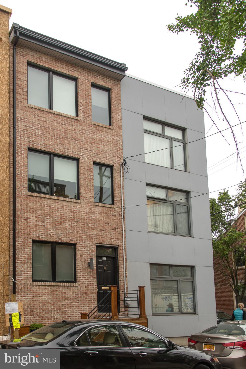 Tucked away on a quiet street in Northern Liberties is this one of a kind, three story retreat. The custom tile entry landing greets you upon your first step. The kitchen/dining area is light-filled with wood floors, custom quartz countertops, custom reclaimed wood range hood, custom reclaimed wood shelving as well as all stainless finishes, including wine storage,insta  hot and pot filler and dishwasher. The second level living space features a custom built unit and recessed lighting, with plenty of storage for your needs. There is a powder room on this level with tile flooring. The upper level master suite has a sliding reclaimed barn door entry to the bath, with custom subway tile throughout. Spacious custom closets are featured in the master suite as well, with a wall of exposed brick adding character. From this level, walk out to your private rooftop deck to enjoy unobstructed views of downtown and the surrounding neighborhood. The lower level is home to the laundry area, with a carpeted finished space with recessed lighting. This is a thoughtful and well-planned space, and is ideally located in the heart of Northern Liberties. Convenient walking distance to the El and public transportation, as well as easy driving access to area highways. And of course, walking distance to all the local Northern Liberties and Fishtown attractions. Tax abatement until 2025.