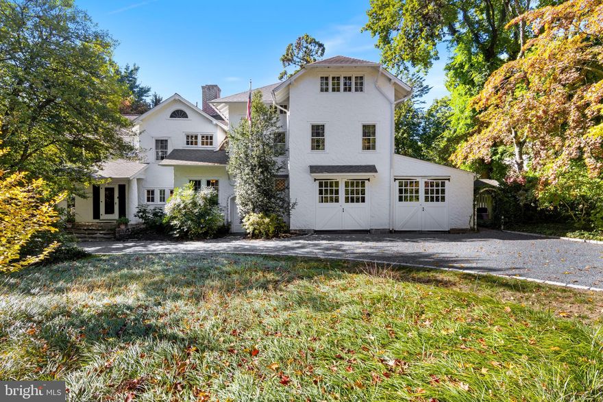 Lyncroft is crafted in the style of a California Craftsman yet finished in a more conservative east-coast style. James Renwick Kerr and his wife Anne Rulon Wetherill Kerr were the first owners of the home, constructed in 1905. Anne’s father started one of the largest engine manufacturing companies in 1871 called Robert Wetherill & Co. Their specialty was the Corliss steam engine and they highlighted their engines during the Centennial exhibition in Philadelphia in 1876. Married at the age of 24, it is hard to imagine that Mr. & Mrs. Kerr had the financial means to design & construct such a beautiful residence. One can only guess that this was a wedding present from her parents, to keep her close to home! James Renwick Kerr spent his adult life as a sales executive with the Allied Chemical Company, but was also an avid member of the Rose Tree Hunt Club. What stands today is a well-loved & crafted home that provides exceptional details combined with modern updates throughout. A pebble drive welcomes guests to the front entry. The double car garage is a solid masonry structure that still retains the original carriage house doors. On the nearly 1 acre parcel are so many mature specimen trees, shrubs & perennials, providing privacy from any neighbors & four seasons of interest. The floor plan provides for great circular flow between all of the rooms. One accesses either the family room or the living room from the entry foyer.  The primary staircase to the 2nd floor is to the right of the fireplace in the living room. Two sets of doors leads one directly outside to the side covered porch & rear brick patio that is covered with Wisteria over the pergola. The dining room is directly on the back side of the fireplace, with a 2nd fireplace & windows in two walls, with coved crown molding & recessed lighting. When the owners renovated the kitchen, they elected to retain the distinct separation of spaces, yet crafted a unique pass-through window to the dining room. There is a vestibule between the kitchen, family & dining rooms that has a walk-in pantry. The kitchen retains a more original/authentic feel with inset cabinetry painted in a rich blue/green.  A 48” Viking stove anchors the southern wall & every wall has abundant cabinetry. An island can seat two for casual meals or just gathering for chit-chat. There are soapstone counters & Mercer tiles that decorate the backsplash. A rear porch was modified to provide for a first floor laundry. Just outside the kitchen is a fully fenced perennial & vegetable garden along with a unique pond. The powder room is located in the corner of the family room by the rear staircase. The family room has a wall of built-in bookshelves & storage cabinets & a bay window overlooking the front yard, a perfect spot for your cats or dogs to watch the comings and goings outside. On the 2nd floor, the owner’s suite retains another one of the original details, the sleeping porch, still used to this day to enjoy evening breezes & cool-night sleep-outs! There is a closet, just for shoes! Originally part of another bedroom, there is a home office area overlooking the rear yard with a storage closet & a walk-in closet connected to the owner’s suite. There are two hall bathrooms on the 2nd floor. The one has both a stall shower & a soaking tub, while the 2nd bathroom has a stall shower. There are three more spacious bedrooms, two of them have wood burning fireplaces! One has three walls of built-in bookshelves. There are actually TWO staircases to the 3rd floor! One to the unfinished attic that provides exceptional storage as well as access to one of the air conditioning systems. The other takes you up to even more living space!  There is a family room that has two distinct spaces, two more bedrooms and the 3rd full bathroom that has a stall shower. One can walk to the Rose Valley-Moylan SEPTA station and downtown Media, or drive to the airport in less than 15 minutes!