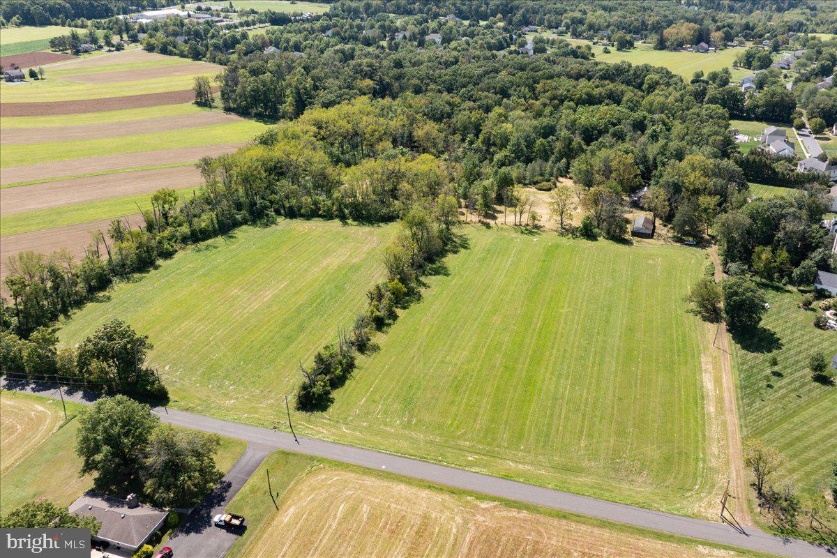 Welcome to 508 Telegraph Rd, a rare and versatile opportunity in desirable Hilltown Township. Set on approximately 25 acres of open and wooded land, this property features a spacious 2,628 sq ft Bucks County stone farmhouse with 3 bedrooms and 2 full bathrooms, plus flexible multi-family or accessory living potential.
Built in the 1800s, the residence combines historic character of random width floors, oversized fireplaces and deep windowsills with abundant opportunity for modernization, restoration, or creative redevelopment. A detached oversized multi car garage and mixed exterior finishes complement the property’s functional layout, while well and septic utilities provide self-sufficiency yet public water and sewer is available.
The expansive acreage offers endless possibilities: create a private retreat, establish gardens or equestrian facilities, enjoy hiking trails through the wooded areas. Additionally, the 25 acres allows for the next owner to explore the properties subdivision and development potential (subject to township approval).
Privacy and serenity define the setting, yet the location is wonderfully convenient — just minutes to Perkasie’s local schools, shopping, and major commuting routes throughout Bucks County’s famous Doylestown New Hope and many landmark towns and villages.
Whether you envision a legacy estate, income-producing property, hobby farm, development project or a long-term investment, 508 Telegraph Rd provides a unique canvas with remarkable upside.