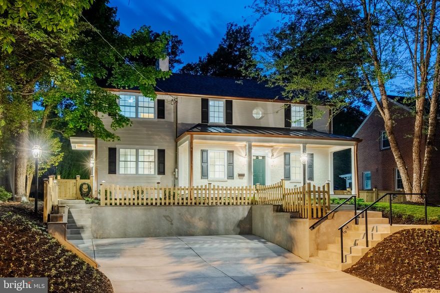 Introducing a signature architectural restoration by the Design Build Group, this thoughtfully expanded and fully rebuilt luxury Colonial is set in one of Silver Spring’s most desirable neighborhoods, Woodmoor. Known locally for their quality craftsmanship and attention to detail, the builder has delivered a home of exceptional scale, finish, and livability—completely turnkey and designed for modern life.
Nestled in a serene, tree-lined setting near protected parkland and forest trails, the property offers a rare blend of privacy, nature, and convenience. The exterior is entirely maintenance-free, with a timeless mix of brick, Hardie siding, metal accents, and thoughtfully designed outdoor spaces including classic covered porches and a private, fenced yard.
Inside, nearly 3,000 square feet of finished living space unfolds with a sense of openness and purpose. Sunlit living and dining areas are anchored by a gas fireplace and enhanced by custom millwork, while a wet bar with granite butler’s pantry creates an effortless flow for entertaining.  A mudroom and powder lead to a gourmet kitchen featuring quartz countertops, generous cabinetry, a large peninsula and eat-in area designed for gathering.
Upstairs, four (4) well-proportioned bedrooms include a striking primary suite with cathedral ceilings, multiple closets, and a spa-inspired bath with marble vanities, soaking tub, and walk-in rain shower. A full laundry room with sink and additional full bath completes the upper level.
The finished lower level adds flexible living space with a large recreation area, kitchenette, and full bath—ideal for guests, entertaining, or extended stays—with direct access to the landscaped rear yard.
Every aspect of the home reflects careful planning and high-quality execution, from the systems and materials to the lighting and smart home features. The result is a pristine, move-in-ready residence offering comfort, efficiency, and enduring classical style.
All of this within the vibrant Woodmoor community, known for its strong neighborhood feel, tree-lined streets, nearby parks, and easy access to shopping, dining, and commuter routes—creating a lifestyle that is both connected and quietly refined.