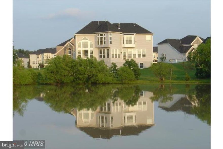 Gorgeous luxury home (half acre land) with beautiful back yard view of trees and a large pond. Open floor
plan. Stunning combination of stone and brick front boasting 3-car side load garage. Dramatic 2 story foyer
entrance & 2 story family room. Hardwood throughout main floor. Beautiful back yard view of trees and a
large pond. Walk-out basement. Nice community. Close to Rt 50 and Rt 28. *** 3 mins driving to LOUDOUN county TRANSIT BUS STOP  to Metro and DC!