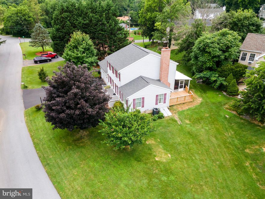 Welcome to this exquisite four-bedroom, three-bathroom  residence, thoughtfully designed for comfort and convenience. Nestled in the highly sought-after Briarwood neighborhood, this home boasts a corner lot, a delightful sunroom , and a charming wood-burning brick fireplace, offering both warmth and character. The master bedroom also has roughed-in plumbing in the walk-in closet providing a wonderful opportunity for customization.
This well-maintained, single-owner home is equipped with natural gas , with hook-ups available for both the fireplace and wood stove. Enjoy the additional benefit of an "inactive HOA" , meaning no fees to worry about. 
The location is just five minutes from Berkeley Medical Center and War Memorial Park , which offers a pool, splash pad, concession stand, putt-putt golf course , and several playgrounds.

Convenient access to I-81 adds to the home's appeal, making commuting a breeze. With a brand-new HVAC system installed 2 years ago and set on .31 deeded acres, this perfectly blends comfort and practicality. Discover your new sanctuary in Briarwood today!