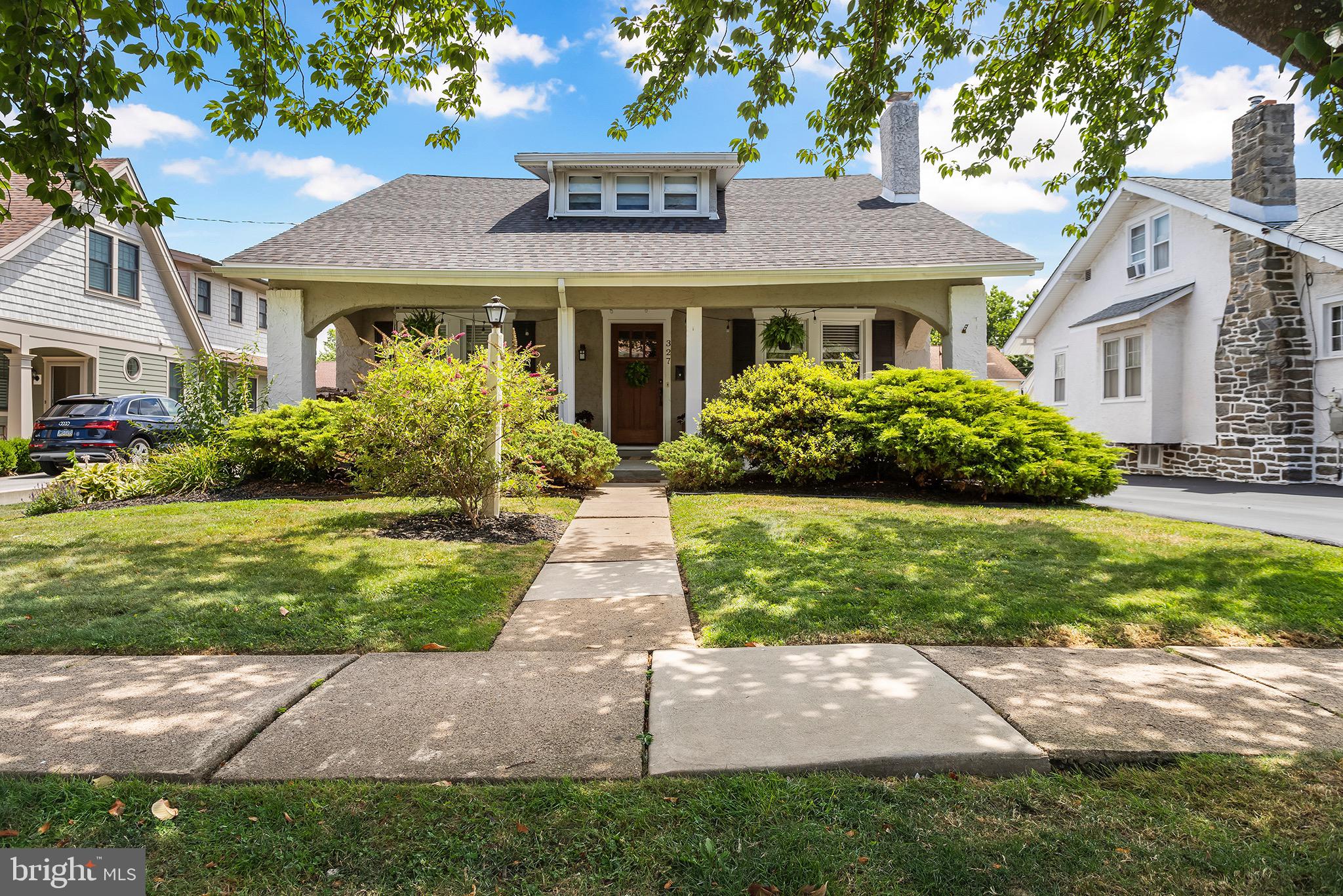 Charm and character are found in equal measure along with plentiful living space in this craftsman style bungalow set in the perfect location in Havertown! Park in the driveway and enter by way of the large covered front porch complete with porch swing. Curb appeal abounds with mature flower beds flanking the front steps. Inside the spacious living room the gleaming original hardwood floors, custom molding and recessed lighting all highlight the stone fireplace flanked by piano windows. To the left of the entrance is another sitting room that could be used as a playroom or home office. The home opens into a sunny dining room with a huge picture window to let in tons of natural light. Dining room also features wainscotting and crown molding. From here a breakfast bar separates the gourmet kitchen from the dining area. Kitchen features include white cabinets, updated countertops, subway tile backsplash, decorative pendant lighting with wood stained beam, and breakfast nook. Kitchen accesses to the back deck/yard as well as the finished basement. Also on this level is a convenient first floor bedroom that the current owners use as a creative space and off the center hall is a full bathroom with linen closet and tub. Upstairs are three additional nicely sized bedrooms. Main bedroom includes a walk-in closet that spans the full length of the room. A second full bathroom can be found on this level as well as lots of dormer storage. But wait, there’s more! The completely refinished basement includes all weather ceramic tile flooring and tons of extra room for a play space, adult hang, home office, etc. Laundry facilities and an additional toilet are on this level as well. Outside, the back deck has been updated with low-maintenance trex decking and overlooks the yard. A detached garage works for additional storage and the backyard is large and level - perfect for any outdoor activities. Finally, the location makes this home even more ideal. Set in a community that gathers for heritage festivals, music festivals, and Havertown Day, this home is less than a mile away from Haverford schools, Haverford Public Library, popular shops and restaurants along Brookline Blvd and Darby Rd and SEPTA’s Beechwood-Brookline station on the light rail line for easy commuting to Philadelphia.
