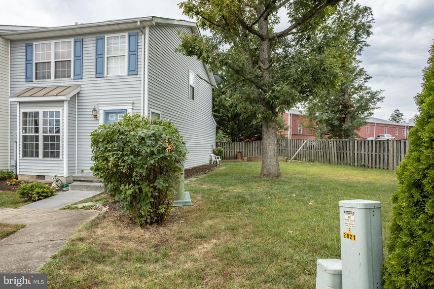 Excellent townhome in very convenient location in town!  3 good sized bedrooms upstairs, 1 and a half baths.  Eat in kitchen with island.  All kitchenn appliances convey.  End unit townhome includes corner lot and very large partially fenced yard.