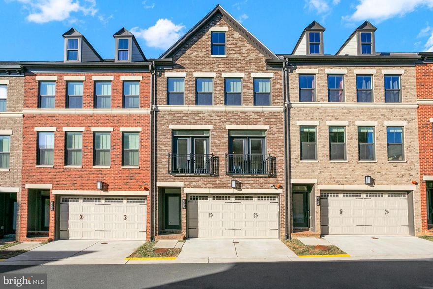 Rare opportunity to own a like-new luxury townhome in North Arlington—just a short walk to East Falls Church Metro, the W&OD trail, local dining, and quick access to I-66. Backing to parkland, this 3,200+ sq. ft. home lives like a single family with three incredible outdoor spaces, upgraded finishes throughout, and an ideal open floor plan. The main level features a stunning chef’s kitchen with quartz countertops, an oversized island, designer lighting, and seamless flow to the family room, dining area, and a covered sky lanai with a gas fireplace and sweeping park views. The entry level includes a spacious rec/media room with full bath and walkout to a private backyard that opens to green space, plus a 2-car garage. Upstairs, the primary suite offers two walk-in closets and a spa bath with double sinks and a two-fixture shower, accompanied by two additional bedrooms and a walk-in laundry room. The top floor provides a versatile bedroom/office or bonus suite with a full bath and private rooftop terrace with expansive sightlines. With modern luxury finishes, abundant natural light, and unbeatable accessibility, this home is truly a rare find. Pets allowed on a case by case basis for $50/dog/month.