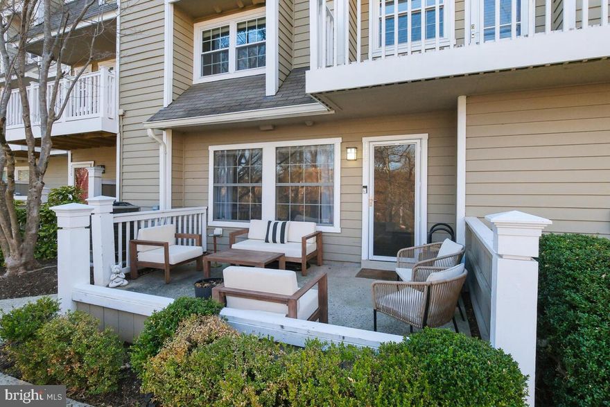 ALL OFFERS ARE DUE BY TUES, APRIL 8TH AT NOON. (Seller reserves the right to accept an offer before the deadline)   ONE LEVEL LIVING AT ITS FINEST!! Welcome to this stunningly renovated two-bedroom, two-bathroom condo in the highly sought-after Gables community.  As you step into the living space, you'll notice custom flooring throughout, an open layout, and crown molding framing the space. Enlarged windows allow for an abundance of natural light, and custom electronic shades add convenience and style.  A wood-burning fireplace adds warmth when its cold outside.  The dining area features a built-in bench with storage, providing both comfort and practicality around the table. The modern kitchen is a chef's dream, featuring stainless steel appliances, designer backsplash and cabinetry and quartz countertops, The kitchen also includes an added pantry space, offering extra storage for all your essentials and a pocket door enclosing the front-loading washer/dryer. The spacious primary bedroom offers an en-suite bathroom and an oversized closet with additional storage. The bathroom is outfitted with a designer vanity and custom tile shower/tub. The second bedroom has two closets, while the second full bathroom is complete with a designer tile walk-in shower, sliding glass doors, and an oversized custom vanity. This condo is special for its privacy and extensive updates, making it stand out from the rest. The  large outdoor patio faces a serene wooded area, providing a peaceful retreat and added privacy, perfect for relaxing or dining.  Residents of The Gables enjoy amenities such as a pool, tennis courts, fitness center, racketball courts, and a community clubhouse. Commuting is a breeze with easy access to I-495, I-270, and the Grosvenor Metro Station. Just minutes to  nearby shopping and dining options at Pike and Rose, Wildwood Shopping Center and Old Georgetown Square.