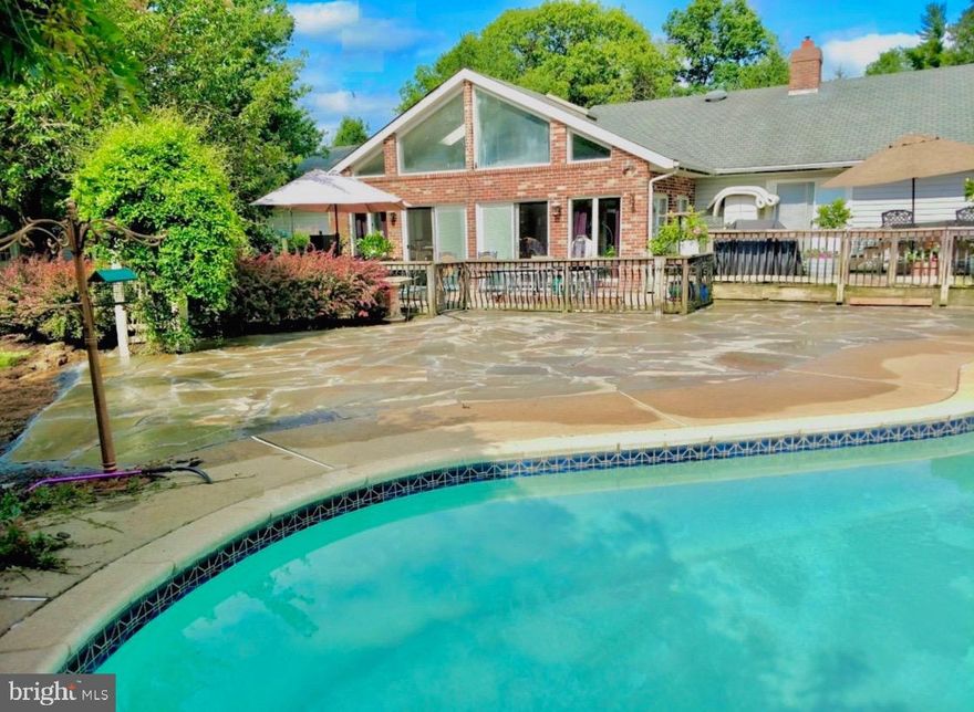 A country delight! Whispering Meadows is situated on ten picturesque acres and includes a custom built 3 bedroom ranch, 5 stall horse barn, in-ground pool, professional woodworking shop, multiple fenced in pastures, orchards with maturing peach, pear and apple trees as well as a chicken coop and multiple storage sheds. Located less than 5 minutes from downtown New Hope,  this property is an incredible value with endless potential.  Upon entering this home you are warmly greeted into a cozy living room with a brick fireplace. The country kitchen boasts plenty of countertop space for preparing homemade goodies and has a massive commercial grade refrigerator. Towards the rear of the house is a wonderful sunroom with vaulted ceilings, newer tiled flooring and offers truly beautiful backyard views of the pool and lush landscaping.  The main level primary bedroom suite has new flooring, new mirrored closet doors as well as new bathroom tiling and glass shower. This room also has direct access to the backyard deck with jacuzzi tub.  A full hallway bathroom services two guest rooms, both of which could also be converted into office spaces or a workout area.  Whispering Meadows provides everything you could ever hope for in a farm property, especially being located so close to town! After over 30 years of ownership the original owners are now passing the torch onto the next lucky Buyers.  If you have an affinity for gardening or farming,  love horses and fresh farm eggs all while appreciating the serenity of beautiful land, then this is the property for you.