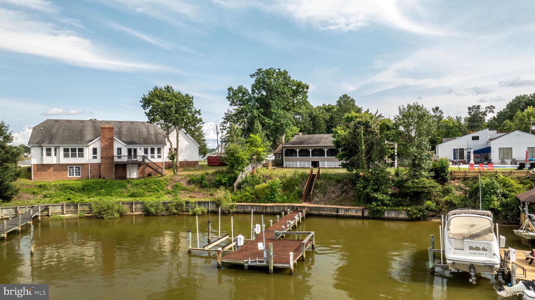 Waterfront 5-bedroom, 3-bath home with pier! Located in a tranquil setting on Monroe Bay and beautifully maintained with over 3,000 finished sqft and move-in ready. Open floor plan, primary ensuite, large family room, screened back porch. garage, and much more! Waterfront with pier, 8-ton electric boatlift, walkway, and sundeck. Located just 10 minutes from the Town of Colonial Beach, 20 minutes to Dahlgren, and 90 minutes to DC or Richmond.
Rental details: No pets, no smoking. The minimum security deposit will be equal to the first month's rent. Tenant qualifications are: minimum credit score of 600, income needs to be 2.5 times the amount of gross rent. No collections, bankruptcies, or judgments. No felony conviction that would show a potential current risk to people in or around the property.