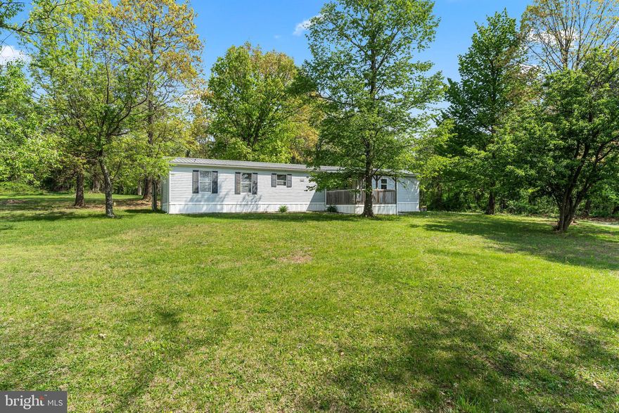 Nestled in the peaceful woods along Nestle Quarry Road in the growing community of Falling Waters, WV, this move-in ready manufactured home offers an excellent opportunity for first-time buyers or savvy investors.  Situated on a 2 acre lot, this property gives you the chance to live comfortably now while saving to build your dream home later. The existing septic system is already rated for a 3-bedroom home, adding future flexibility and value.  The home features a durable metal roof and an efficient heat pump for year-round comfort. Outside, you’ll find a spacious 16x16 storage shed with a concrete floor—perfect for a workshop or extra storage—as well as an additional 8x12 shed ideal for garden tools and outdoor equipment.  Enjoy added freedom with no HOA and only light covenants and restrictions.   Enjoy privacy, potential, and practicality all in one property. Schedule your private tour today!