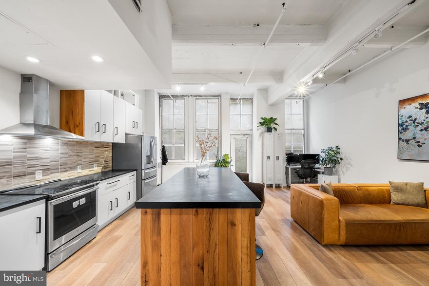 Discover the elegance of 1238 Callowhill St, Unit 102, a beautifully renovated one-bedroom, one-and-a-half-bathroom loft in the historic Beaux Arts Building. Spanning just over 1,000 square feet, this home seamlessly blends modern luxury with classic charm.

As you enter, the sleek wood floors guide you through a tranquil living space. The expansive living area effortlessly flows into the contemporary kitchen, creating a perfect setting for both lively gatherings and peaceful everyday moments. The half bath provides convenience while keeping your bedroom private from guests. 

Step outside to discover one of only two private patios in the building. This outdoor retreat is ideal for morning coffee or evening relaxation. Enhance your downtime with a unique in-unit private sauna, providing a spa-like experience right at home. A versatile nook, currently a plant haven but once a rowing machine, invites you to envision your own personal touch.

Ascend to the shared roof deck, where panoramic city views await, perfect for enjoying sunsets, stargazing, or simply "working" from home.

Nestled in the burgeoning Callowhill Loft District, this home is positioned between Fairmount, Northern Liberties, and Center City. Anticipate vibrant performances and communal activities with the upcoming Philadelphia Ballet nearby. Enjoy the Rail Park for leisurely strolls with your pup, coffee dates, and community events. Support local favorites like Wood Street Pizza, Elixir Coffee, and Prohibition Tap Room just around the corner.

This residence offers the perfect blend of historic charm and modern convenience—an ideal choice for those seeking sophistication and city life. Don’t miss the chance to call this exceptional space your home!