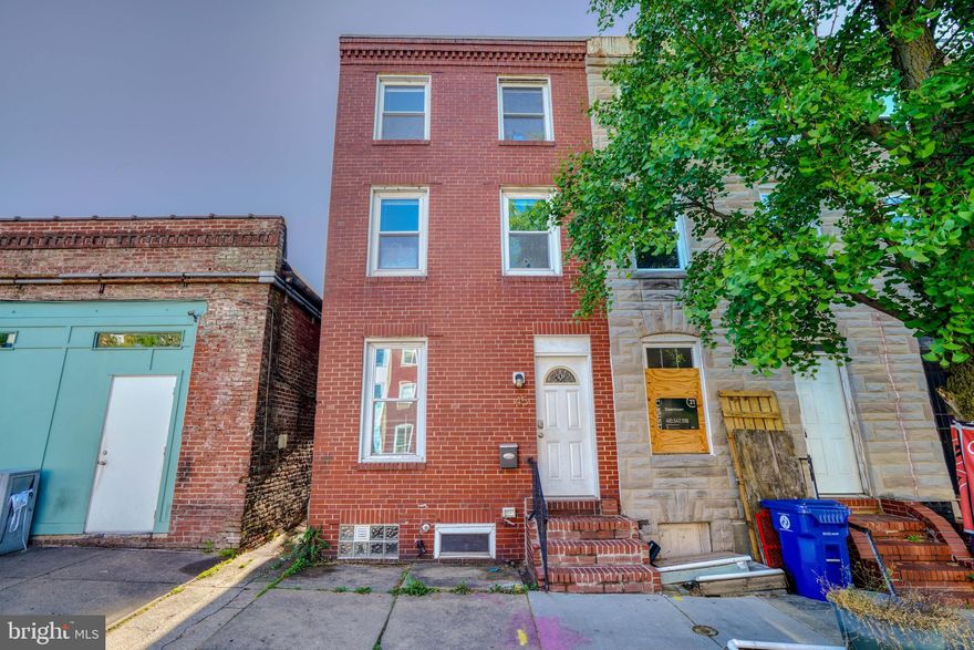 Welcome to the historic charm of Hollins Market, where this delightful brick rowhouse awaits its next owner. Boasting 2 bedrooms, 1 bathroom, and a fenced rear yard, this home offers the perfect blend of character and potential for those with a keen eye for investment.  This classic brick rowhouse features wood floors throughout and a full basement, providing ample space for customization and expansion. The fenced rear yard offers privacy and outdoor space for relaxation or entertainment. While some updates have been completed in the past, there is still room to add your personal touch and increase the property's value. Situated in the heart of Hollins Market, this property enjoys proximity to key landmarks and amenities. Nearby attractions include UMAB, Oriole Park, and the Ravens Stadium, making it an ideal choice for sports enthusiasts. Additionally, Downtown Baltimore is just a short drive away, offering access to a vibrant array of dining, shopping, and cultural experiences.