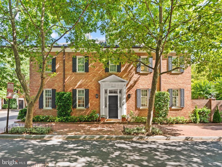 Perfectly positioned on a coveted corner in Georgetown’s East Village, this elegant semi-detached Federal residence offers over 5,000 square feet of thoughtfully designed living space. Fully renovated in 2016, the home combines classic Washington sophistication with contemporary comfort across six bedrooms and four-and-a-half bathrooms.

The main level is designed for both everyday living and entertaining, with abundant natural light from three exposures and a seamless flow to the bluestone terrace. Highlights include maple hardwood floors, a chef’s kitchen with striking marble countertops, and the convenience of gated one-car parking.

The expansive primary suite serves as a true retreat, complete with multiple walk-in closets, a private office, and a spa-like bath with a steam shower and soaking tub. Upstairs, four additional bedrooms and two full baths provide generous accommodations.

The lower level extends the home’s versatility with a large living area, built-in bar, sixth bedroom, gym, and spacious laundry room.

Turnkey and meticulously maintained, this home offers every modern amenity while being just steps from Georgetown’s vibrant dining, shopping, and timeless charm.