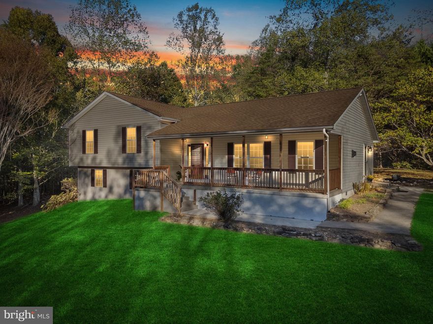 Escape to the Culpeper countryside with this 4 bedroom, 2.5 bath home tucked away on over 7 acres of peace and privacy. This beautiful tri-level sits above the road with trees surrounding the property perfectly blending comfort and seclusion. The land offers room to breathe, explore, and create your dream rural lifestyle. Imagine mornings with nothing but the sound of nature, evenings under a blanket of stars, and endless possibilities for gardening, homesteading, or simply unwinding. The spacious and inviting front porch overlooks the established raised gardens. Step through the front door into an open floor plan with family room, eating area and large kitchen with new granite countertops, sink & flooring.  Open the french doors to the rear yard with ample room for backyard entertaining and an inviting large open deck.  Move up a few steps and down the hall you'll find the bedroom area with an updated primary bedroom to please the owner of the home.  The custom primary bath has been completely updated to include a dressing cabinet with beautiful custom stained glass, and a walk in shower.  There is expansive storage under the sink area.  Down the steps to the lower area find a freshly painted bedroom with new carpet as well as an open area for recreation, storage or work area.  If privacy is a must, for room to grow and enjoy the outdoors, this the property for you! Located conveniently between the town of Culpeper and Sperryville.