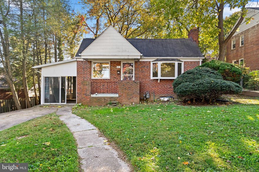 This cozy bricked, ranch style home is ready for updates and someone who is looking for a house to make their own.   Front door opens into freshly painted, hardwood covered large living room with wood burning fireplace.  Granite countered kitchen opens to the dining room allowing for casual visitation and conversation while preparing a meal.  Two bedrooms on the main floor have hardwood    House is positioned well back from the street, but still plenty of room in the back yard for gardening. 
Basement has a  large spare guest room and a large living room.   Large greenhouse  out back is ready for a re-do or a conversion to a large shed.   Priced to sell.  Furnace not currently working. House being sold as-is, preferably to someone who has vision and a desire to make this house their own.