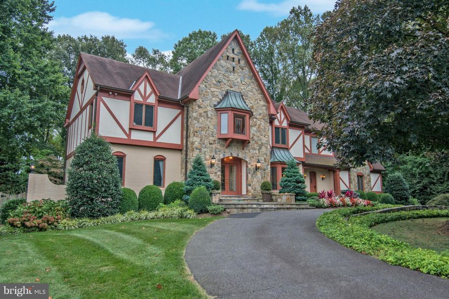 This handsome Tudor has it all - quiet cul de sac, circular drive, huge fenced private backyard, pool, guest house & four car garage within one mile of the Silver Line Metro. Over 7,300 sf of living with dramatic two story great room w/wall of windows, sunroom adjoining kitchen, cherry paneled library, large master suite w/luxury bath, expansive lower level w/au pair suite & kitchenette.