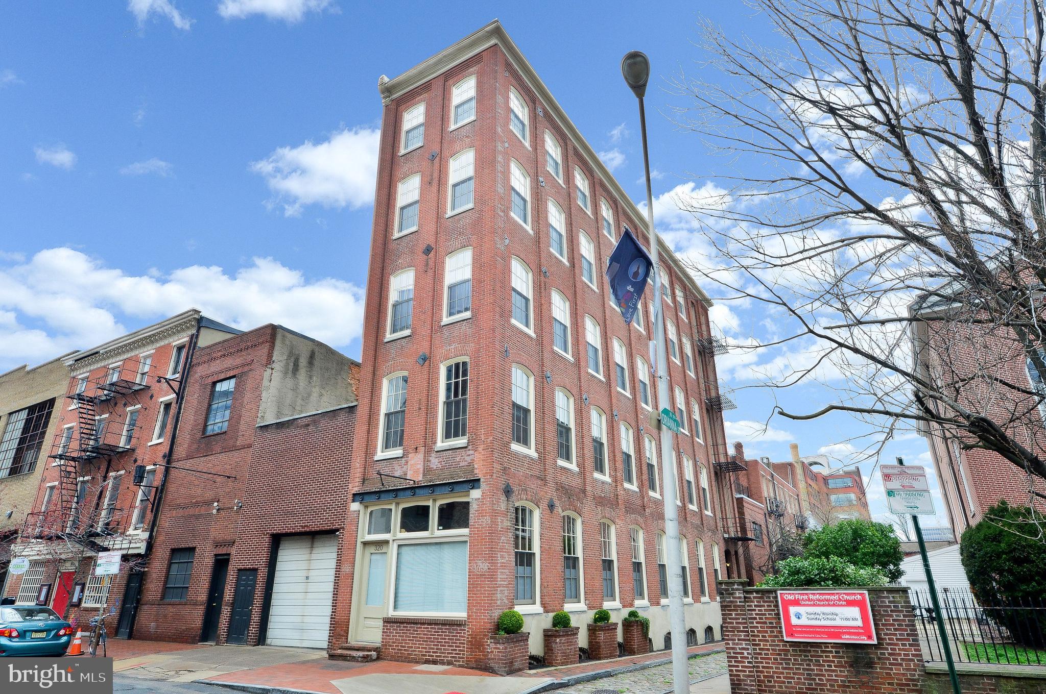 It doesn't get any more "Old City" than this! Built in 1854, this 2 bed, 2 full bath condo unit is a historically certified building that once housed Saxe Paper Company with the faded signage still visible on the brick facade. Check out the building's entire fascinating history on HiddenCityPhila (2015/04/a-slim-and-sturdy-survivor-on-race-street/). In 2002, this 5-story building was converted into a 5-unit condominium; commercial space on the first floor (currently an Art Gallery), and one residential unit per floor above. Unit B is the entire second floor, which is situated high enough to overlook Orianna Street; a narrow alley paved with Belgium blocks. This apartment features 12-foot ceilings (WOW!), exposed brick, original wood beams, natural hardwood floors, and an open-style galley kitchen with SS appliances and gas cooking. Perhaps the most impressive feature is the enormous Cathedral-Style windows, which were just replaced in 2019; FLOODING this corner unit with natural light (Western exposure). If you require parking, you'll be pleased to know there is a parking garage two doors down with availability but this perfect Old City location is walkable to just about everything! HOA Fees are low because the small Condo Building is self-managed. This home has the WOW FACTOR, so schedule your showing ASAP!