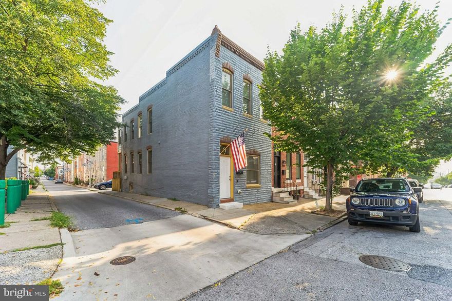Welcome Home to this beauty!!  Pick your favorite feature on this end-of-group row home ... the two car parking pad out back?? ...the fact that it is 3 true bedrooms upstairs?? ...or that is updated and really move-in ready?? This home is as lovely as the pictures show!! The main level has a good size living room with the exposed brick interior wall that leads past a powder room with a pocket door (doesn't everyone love a pocket door??) into your updated kitchen complete with an island, granite countertops, stainless steel appliances and so much cabinet space!! Upstairs you will be welcomed by three generous sized bedrooms all with their own ceiling fan and an updated full bathroom. The basement has been fully waterproofed and serves as so much storage under the front half of the house and the back half of the basement has taller ceilings with the laundry area, and yes, the washer and dryer are newer and they do convey with the purchase! All this just one block north of Patterson Park with a great walkability factor!!