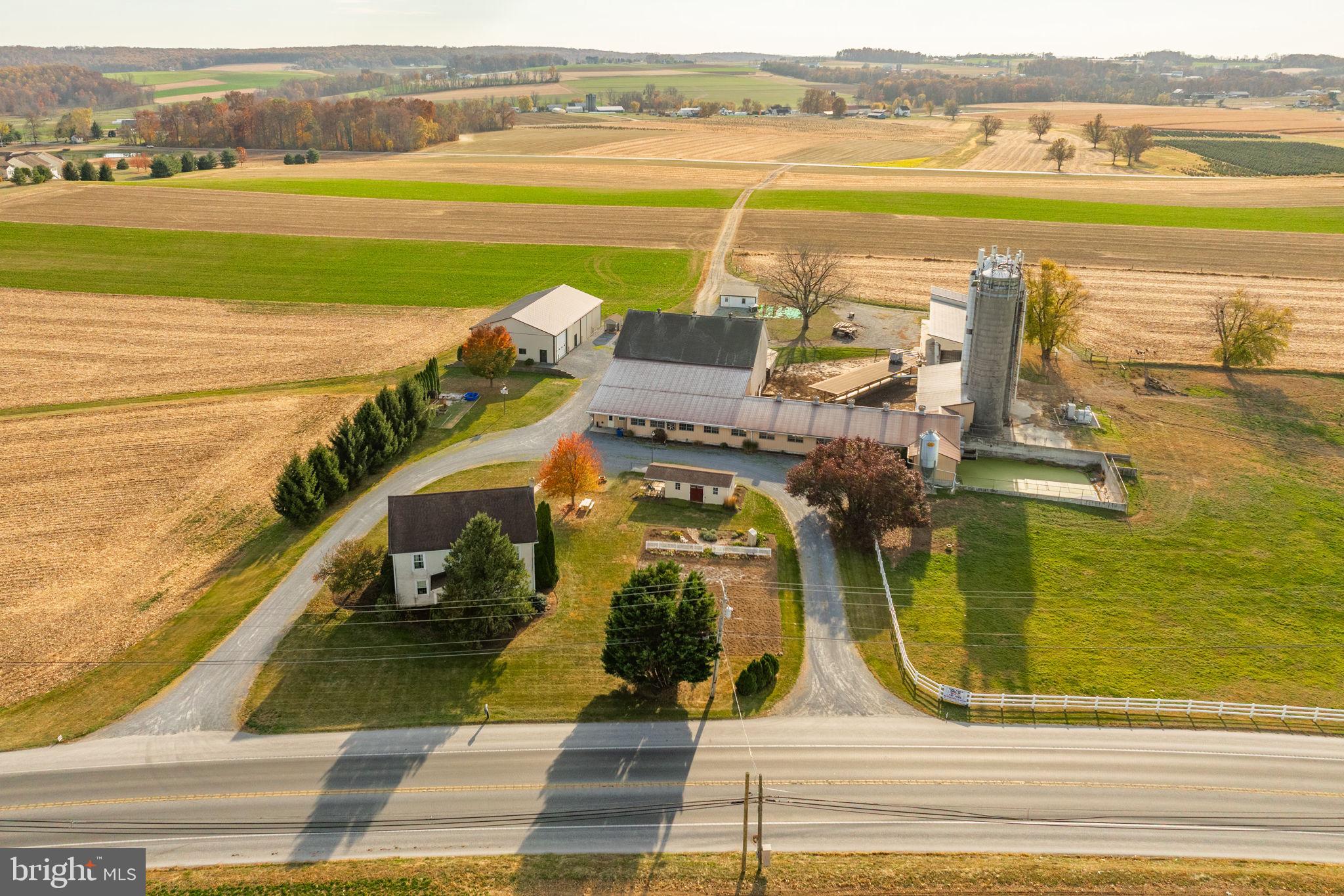 2 ½ Story 5 Bedroom FARM HOUSE w/2895 SF, eat-in kitchen, 2 full baths and a daylight basement. OUTBUILDINGS: 2 Story BANK BARN 45x64 w/35x155 DAIRY COW ADDITION w/ 58 tie stalls, tunnel ventilation, 2” SS pipeline. 1500 Gal DeLaval Tank. 25x65 FEED ROOM addition w/ Silo Access (3) Stave Silo’s. 2-20x62 w/unloaders, 15X65 SEALED Stave w/bottom unloaders. NOTE: T-Mobile antennas in one silo w/ monthly rent revenue of $1400. HEIFER BARN -25X100 W/ open front concrete floor w/ pit, head gates, and 25x20 Feed Room. MACHINERY BUILDING: 50x80 built 2009. 14’ eave height, concrete and gravel floor. Land 90 Acres w/70+ tillable. Frontage on Horseshoe Pike and Park Rd. Zoned Ag. Farm is in Clean and Green but not in AG Preserve. High State Productivity.