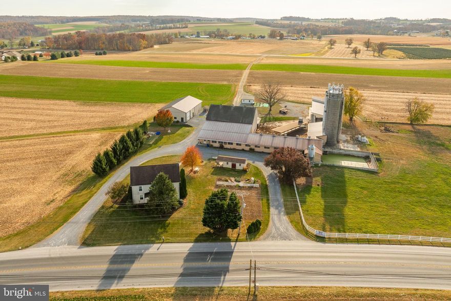 2 ½ Story 5 Bedroom FARM HOUSE w/2895 SF, eat-in kitchen, 2 full baths and a daylight basement.  OUTBUILDINGS:  2 Story BANK BARN 45x64 w/35x155 DAIRY COW ADDITION w/ 58 tie stalls, tunnel ventilation, 2” SS pipeline. 1500 Gal DeLaval Tank.  25x65 FEED ROOM addition w/ Silo Access (3) Stave Silo’s. 2-20x62 w/unloaders, 15X65 SEALED Stave w/bottom unloaders.  NOTE:  T-Mobile antennas in one silo w/ monthly rent revenue of $1400.  HEIFER BARN -25X100 W/ open front concrete floor w/ pit, head gates, and 25x20 Feed Room. MACHINERY BUILDING: 50x80 built 2009. 14’ eave height, concrete and gravel floor.  Land 90 Acres w/70+ tillable.  Frontage on Horseshoe Pike and Park Rd.  Zoned Ag.  Farm is in Clean and Green but not in AG Preserve.  High State Productivity.