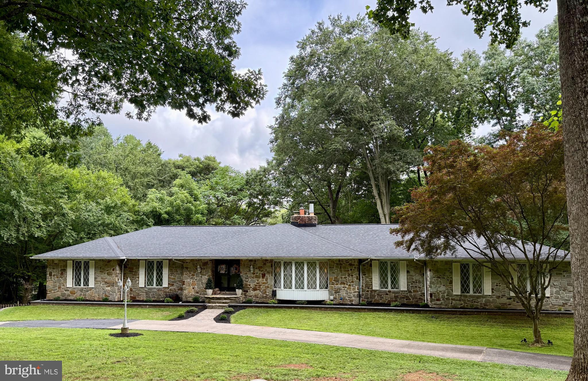 Large home on unique 14 acre, subdividable, partially wooded lot at end of street up against the Gunpowder Park in sought after Kingsville. Excellent for privacy, family compound, subdividing, or hunting. You make it your own. This kind of location only comes along once in a while. Original owner of 53 years. Partially renovated, but still needs work, including the back yard, pool, and deck. Lots of opportunities to bring your style and vision to this beautiful home. Three bedrooms and three bathrooms on upper level that are all fully updated. 4th bedroom and 4th full bath in basement. Basement fully finished. Ground level walkout basement, including side and rear entrances, and windows along full length. Unique features all throughout, including an indoor grill, sauna, and large basement bar. Upstairs and downstairs fireplaces. Two zone HVAC with heat pumps with propane backup. Full house 26kw Generac propane generator and 1,000 gallon fully owned propane tank installed in 2022. Septic recently improved and inspected and in excellent condition. All appliances, laundry, hot water heater, HVAC, roof, etc. replaced within the last 5 years. 18’ garage door brand new this year.