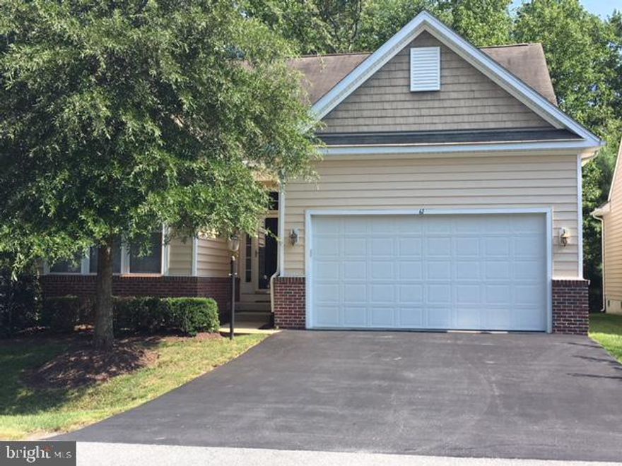 Beautiful 'Osprey" Model - features  open plan with sunroom that backs to wooded area. Hardwood Foyer, large master  bedroom and double sink vanity in master bath. Large walk-in closet. Original Owner's 2nd home- gently used -Move In Ready Furnished.
