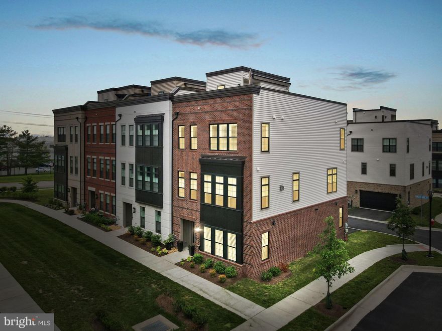 Don’t miss your opportunity to experience elevated living in one of Ashburn’s most desirable Adult Communities! This 3 Year young, four-level sophisticated and meticulously upgraded End Unit shows like a model! This home has been thoughtfully designed with over 3,255 square feet of refined living space that features 3 Bedrooms, 3.5 Bathrooms, a Roof Top Terrace for entertaining and Elevator access to each floor.

Step inside to elegant, engineered Pecan Hardwood floors on the entry level that flow to the Main Level and upper hallways. The Main Level has a Gourmet Kitchen with modern full-overlay cabinetry, Calcutta Gold Granite waterfall island, tiled backsplash with cabinets galore and premium KitchenAid appliances. The Family Room Gas Fireplace is surrounded by floor-to-ceiling slate tile. Enjoy music and entertainment throughout the home with built-in speakers throughout plus surround sound in the Family Room. Whether you're hosting friends or preparing an intimate dinner, this Main Level is designed to impress! 

The Bedroom Suite on the Entry Level has a Full Bathroom, ideal for guests or multi-generational living. The Upper Level includes two spacious Ensuite Bedrooms with floor-to-ceiling ceramic tile showers and an expanded Laundry Room. Retreat to the Rooftop Terrace which is an entertainer’s dream complete with a gas fireplace, motorized awning, pre-wired speakers, a dedicated gas line for grilling that’s already connected to a Weber grill—all ready for your next sunset gathering!

A vibrant lifestyle with community amenities awaits you at Belmont Country Club through your Social Membership providing access to swimming, dining, and social facilities at the Club. Membership also includes access to the sand volleyball court, 3 hard tennis courts, basketball courts and soccer field.

The Regency at Belmont Chase is in close proximity to Whole Foods, restaurants, shops, commuter routes and INOVA hospital.