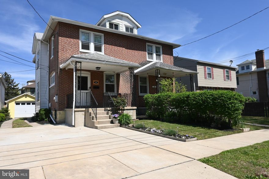 Wow, Nice Twin Home with Private Parking, Detached Garage, Situated on a Fenced Level Lot with Garden Beds all around.  Step Inside from the Breezy Front Porch to Shiny Hardwood Floors that enhance the style as well as comfort in the Open Living Room.  Updated Sunlit Windows throughout Brighten this cheery Home.  The Kitchen is Lovely with Ceramic Tile Floor, Tumbled Backsplash, Classic White Cabinetry, Stainless Steel Appliances, Granite Topped Counters and Center Kitchen Island with Sink, Dishwasher and Seating!  Enjoy Backyard Entertaining and Leisure just outside of the Casually Finished Mud Room with Luxury Vinyl Flooring and Separate Powder Room.  Upstairs finds those same Hardwoods, a Beautifully Finished Ceramic Tile Hall Bath with Glass Tile Accents and updated Modern Fixtures and two Good Size Bedrooms. The Master Bedroom is Expanded to include a Sitting Area and really opens up the original space.  There's also a Deep Walk-In Closet PLUS separate Access to Walk-Up Floored Attic for added Convenience and Plenty Extra Storage Space.  Finally, the semi-finished basement is clean and dry. 
 It's a versatile space that can be fully finished for additional Living Space, Recreation and of course Storage.  There is also a Separate Workshop Utility Room and a Laundry Area. Newer Heater (11/23), mini split cooling system (7/19) and hot water heater (3/23).
.