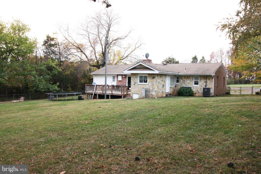 HOME WARRANTY INCLUDED!! MOVE-IN READY BRICK AND STONE ONE LEVEL RAMBLER LOCATED AT THE BORDER OF BRISTOW AND NOKESVILLE. CONVENIENT LOCATION WITH .53 ACRE OF PRIVACY. UPGRADED KITCHEN WITH STAINLESS STEEL APPLIANCES AND MASTER BEDROOM/BATH ADDITION IN ONE WING OF THE HOME. UPGRADED ELECTRICAL IN 2015. LARGE DECK, BRICK FIREPLACE AND HOME BACKS TO TREES.