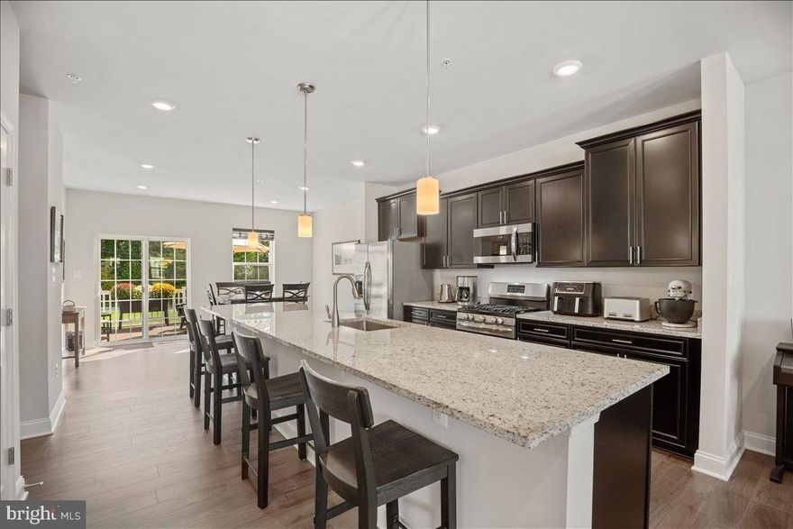 Welcome to this beautifully updated and truly move-in ready townhome in the highly sought-after community of The Woods at Myrtle Point. From the moment you step inside, you’ll notice the attention to detail and modern design that set this home apart. Featuring an open-concept layout with granite countertops, stainless steel appliances, and gas cooking. The kitchen flows seamlessly into the spacious living and dining areas, perfect for both entertaining and everyday living. Upstairs, you’ll find a luxurious primary suite that feels like a retreat with a spa-inspired en-suite bathroom, complete with a custom tile shower and updated finishes. Down the hall, you’ll find 2 more bedrooms with extra ceiling lighting because they’ve been the Sellers’ craft rooms. A second full bathroom with tiled shower and laundry area are also on this level. Outdoor living is just as impressive with low-maintenance Trex decking, a covered paver patio and open space views. One of the many standout features of this property is the fully finished basement. The basement space includes a suite with tiled full bath, a flex space currently used as an office, and access to the beautiful covered patio and gardens. Located just down the street from Myrtle Point Park, you’ll have easy access to miles of hiking and biking trails, scenic water views, and picturesque beach days just minutes from your doorstep. Whether you’re looking to unwind in nature or enjoy community amenities, this location has it all. Don’t miss this opportunity to own a beautifully upgraded, versatile townhome in a fantastic neighborhood!