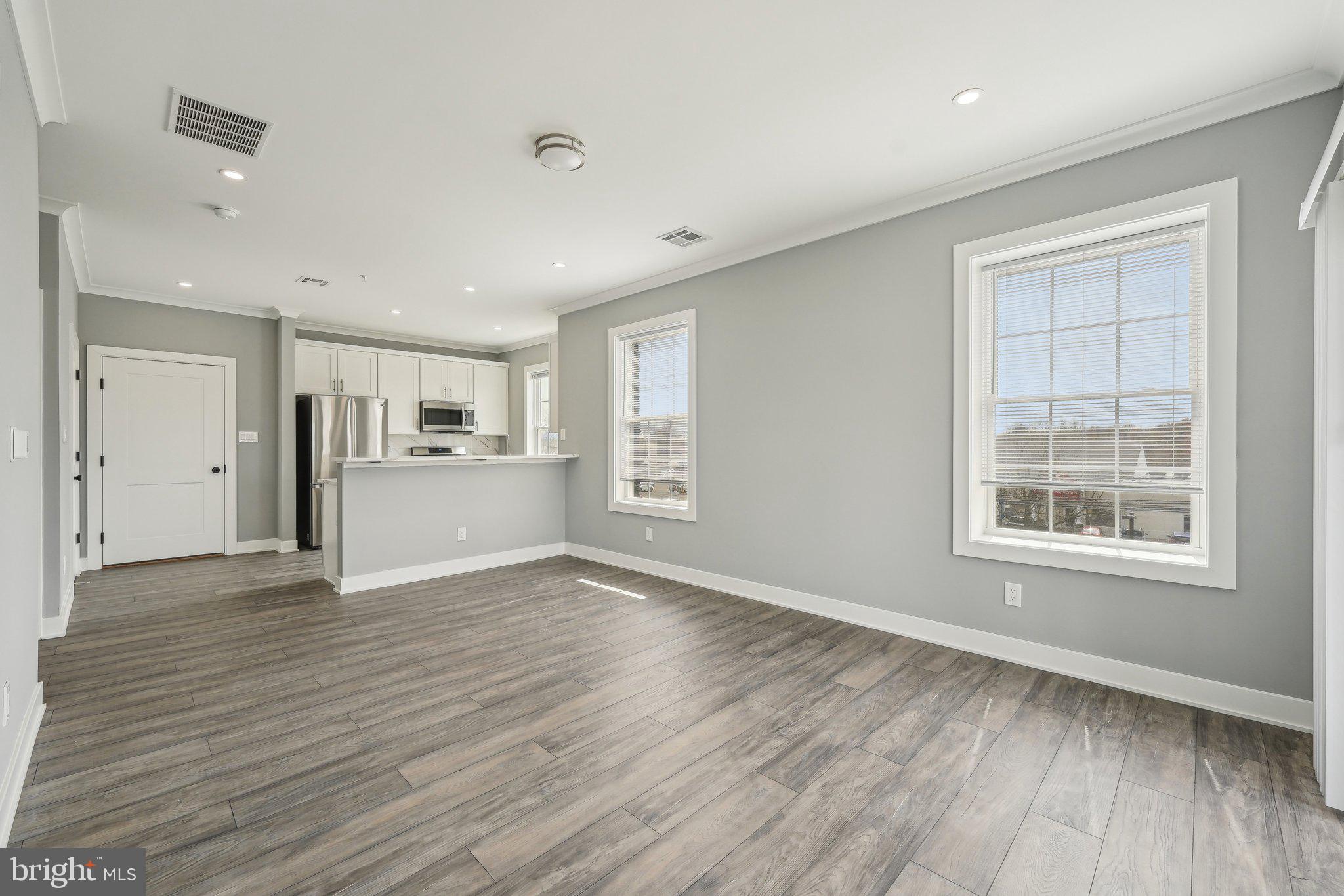 Nestled at 2421 Bristol Road in the heart of Warrington, Pennsylvania, The Warrington Place is a thoughtfully crafted residential community that blends upscale finishes, modern conveniences, and timeless style. Offering one-, two-, and three-bedroom apartment homes, the property is designed to meet the needs of today’s renters who value both form and function in a refined, suburban setting.
Inside each residence, you’ll find open-concept floorplans that maximize natural light and flow, creating a welcoming atmosphere ideal for relaxing or entertaining. The apartments feature soaring nine-foot ceilings and oversized windows, enhancing the sense of space. Gourmet kitchens are outfitted with sleek stainless steel appliances, white shaker-style all-wood cabinetry, quartz countertops, subway tile backsplashes, and oversized islands or breakfast bars in select layouts—perfect for morning coffee or evening meals. Luxury vinyl plank flooring throughout the main living areas adds a stylish, durable touch, while plush carpeting in the bedrooms provides cozy comfort.
Each apartment also includes smart Samsung appliances such as in-unit washers and dryers, allowing residents to handle laundry at their convenience. Spacious bathrooms feature modern vanities, chrome fixtures, and tiled showers or deep soaking tubs. Large walk-in closets provide generous storage, and private balconies or patios in most units offer a quiet space to enjoy the outdoors. Select homes offer premium views or corner locations for even more natural light and privacy.
Beyond the units themselves, The Warrington Place provides a well-maintained environment with controlled access entry, ample private parking, and professional on-site management. The community is located at the intersection of Bristol Road and Route 611, giving residents unbeatable access to major retail destinations and everyday essentials. Whole Foods, Wegmans, Giant, Target, Walmart, Costco, Amazon Fresh, and ShopRite are all within a short drive, making errands quick and easy. Public transportation is also convenient, with a nearby SEPTA bus stop offering a simple commute for those who prefer not to drive.
Warrington itself offers a charming, residential atmosphere with the conveniences of modern suburbia. Residents will enjoy close proximity to a variety of restaurants, local parks, fitness centers, and entertainment venues such as the Regal Cinema. The area is known for its peaceful streets, well-maintained green spaces, and an easy-going pace that makes coming home feel like a true retreat.
The Warrington Place is more than just a place to live—it’s where style meets substance, and convenience meets comfort. Whether you're a busy professional, a downsizer, or someone seeking elevated suburban living, this community delivers a lifestyle that feels both luxurious and effortless.
** Photos are of model units ** Pricing and availability subject to change on a daily basis **