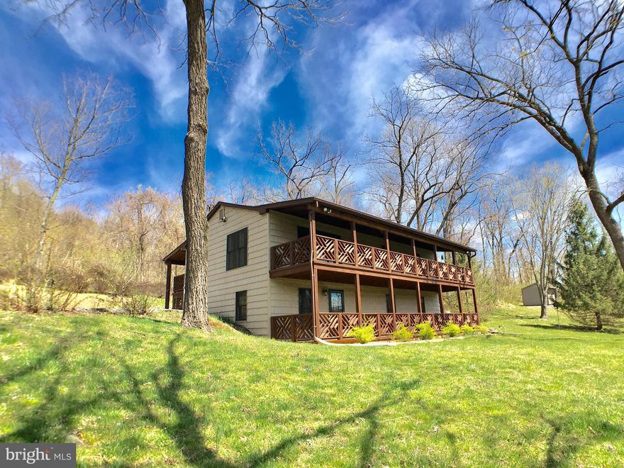 JUST REDUCED! Cabin Style 2-Level Ranch/Rambler w/ Tiered Decking, 2.8 miles to I-66, & close to nearby Farms, Wineries, Hiking Trails, & Wildlife Park to Hunt/Fish. Main Level Features Open Layout Living Rm/Kitchen/Dining Area w/ Vaulted Ceiling and Front & Rear Covered Deck Access, Hall to Bedrms 1-3 & Bathrms 1-2. Fully Finished Lower Lvl w/ Great Room, Den, Full Bathrm #3, & Potential Bedrm. VIRTUAL TOUR         >>>  NEARBY ATTRACTIONS & ROADS  >>  6 Miles to Appalachian Trail Access Point; 3 Miles to Hartland Orchard of "Pick Your Own" (PYO) varieties of Cherries, Peaches, & Apples; 2.2 Miles to Green Truck Farm of PYO Fruits & Vegetables; 12 Miles to Sky Meadows State Park; 15.3 Miles to GR Thompson State Wildlife Management for Fishing & Hunting; 12 Wineries within 10 Mile Radius of Home; 11 Miles to Route 50; 7.3 Miles to Route 17; 2.8 Miles to I-66; 11.5 Miles to Marshall; 14.7 Miles to Front Royal.  >>  HERE'S A CLOSER LOOK  >>  Driveway at end of Belle Meade Road on the Right -- Main Entrance at Rear of Home with Covered Deck Extending Length of Home -- INTERIOR: Entry to Open Layout Living Room / Kitchen / Dining Area with Sliding Glass Door to Front Deck as well as Door to Rear Deck, Vaulted Ceiling, Open Stairway to Lower Level, & Hallway Access -- Main Level Hallway to Master Bedroom Suite with Attached Full Bathroom & Rear Deck Access -- Hall to Bedrooms #2 & #3 as well as Bathroom #2 in Hall -- Stairway to Lower Level -- At End of Stairway, Open to Great Room to Left, Lower Level Front Deck Exterior Door to Right, and Potential Bedroom to Far Right -- Great Room has Flue for Stove (Stove in Photos DOES NOT Convey) & Half Wall Division between Den with Attached Full Bathroom #3 -- Potential Bedroom #4 with Built-In Bookcases & Full-Size Windows -- Laundry Room / Utility Room with Laundry Tub Sink & Built-In Storage Shelving -- EXTERIOR: 16x20 Outbuilding with Electric & Decking -- Storage Shed -- Front & Side Yards with Mature Trees