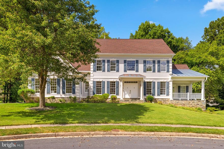 ***OFFER DEADLINE MONDAY AT 12 PM***
This home offers the best of timeless architecture, spacious interiors, and a serene cul-de-sac setting. The classic stone-and-stucco façade, accented by shuttered windows and a covered front porch, creates a welcoming presence. A sweeping driveway leads to a three-car garage, while the private backyard backs to mature trees, providing both beauty and seclusion.

Inside, a grand two-story foyer with marble floors opens to formal living and dining rooms, showcasing detailed millwork and expansive windows. The soaring two-story family room is the centerpiece of the home, with walls of glass and French doors filling the space with light. An adjoining kitchen features an oversized island, walk-in pantry, abundant cabinetry, and a breakfast area that opens to the outdoors. Additional main-level highlights include a sunroom, study, and covered porch, offering multiple spaces to relax or entertain.

Upstairs, the primary suite is a private retreat with a sitting area, generous walk-in closet, and spa-style bath with jetted tub and separate shower. Three additional bedrooms, two full baths, and a convenient laundry room complete the upper level. The walkout lower level, with high ceilings and daylight windows, provides expansive unfinished space with limitless potential for recreation, fitness, or guest quarters. 

Combining over 4,500 square feet of living space with classic design and modern functionality, this residence delivers comfort, elegance, and opportunity—just minutes from Tysons, McLean, and Washington, DC.

Roof is 5 years old.
