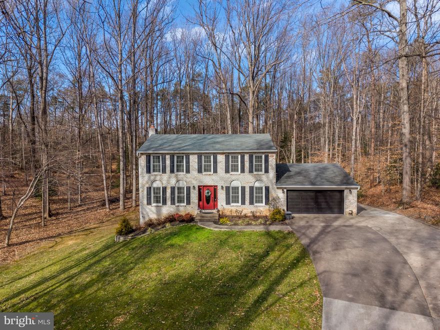 Welcome to 5356 Wade Lane! Pride of ownership is evident in this excellently maintained and updated colonial, ideally situated on a private 1-acre lot in the desirable Hampton's Grove community.
This home offers 4 spacious bedrooms, 2.5 baths with a well-designed layout. The main level features hardwood flooring,  an updated kitchen with ample cabinetry, a center island, and stainless steel appliances, that opens to the family room — ideal for everyday living and entertaining.  The charming enclosed three season room overlooking the private, rear wooded lot provides a peaceful and cozy addition to the outdoor living space.  Upstairs, the hardwood floors continue and the generously sized bedrooms include a primary suite with an updated, private bath. The finished basement provides valuable additional living space ideal for a recreation room, home office, or guest area. The home includes a cellar space under the garage that can be used as a storage and/or workshop space.
Recent improvements include a new HVAC system (2025), new washer and dryer (2025), and a new storage shed (2024), adding comfort, efficiency,  functionality, and much more!  Conveniently located near I-95 and Route 1 for easy commuting. Enjoy access to nearby parks, including Leesylvania State Park, as well as shopping and dining at Stonebridge and Potomac Mills OUtlet Mall. Dulles and  Reagan International Airports are both conveniently located only 30 miles away.
A rare opportunity to enjoy space, privacy, and convenience in one exceptional Woodbridge home. Schedule a showing today!
**Doorway added between primary bedroom and fourth bedroom to create a primary suite with sitting room; easily converted back to a separate bedroom if desired**
*Basement sq ft estimated**