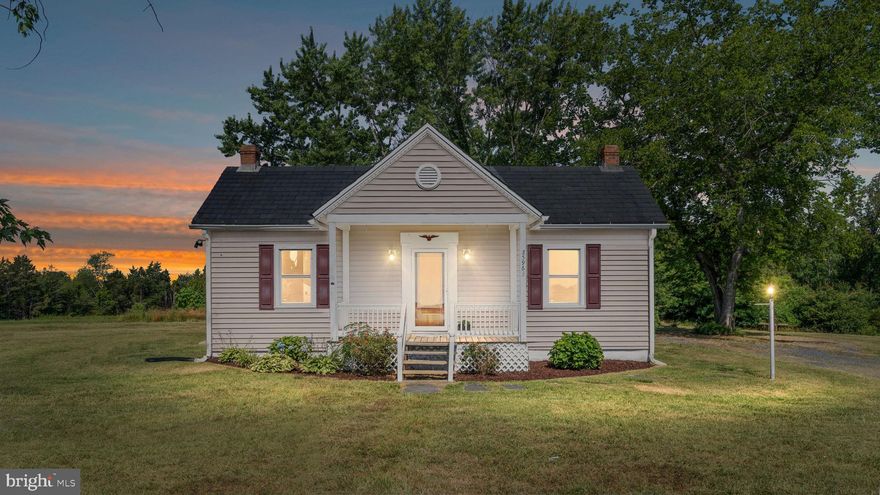 This charming 1906 home sitting on over 7 acres has been lovingly renovated and seamlessly blends historic elegance with modern comforts. All bedrooms, family room, and dining room feature 10ft ceilings, original hardwood flooring, and crown molding. Features include a lifetime slate roof and a beautiful wooden front door with stained glass that welcomes you into the family room. The dining room is open to the kitchen and features an arched entryway and chandelier. The renovated kitchen is spacious with a NEW tile floor, NEW butcher block countertops, and stainless steel appliances including fridge (2019). Heading out of the kitchen is a large laundry room with a tile floor, washer and dryer hookup, and access to the covered rear porch that looks out on the wooded lot. The primary bedroom is tucked at the back of the home with a ceiling fan/light, a closet, and a fully renovated ensuite half-bath featuring a tile floor and pedestal sink. Bedrooms 2 & 3 both feature closets with motion-activated lights and doors to the main living area as well as a shared door between the two rooms. The full hall bath has been completely renovated with a tile floor, vanity, and tub/shower combo. A unique center hallway would be a great nook for a home office. The basement offers tons of storage room in addition to two large utility sheds on the property (12 x 10 and 14.3 x 14.3).  The entire home has been freshly painted. Enjoy country living with over 7 acres to explore, a front sitting porch and a private covered back yard deck.