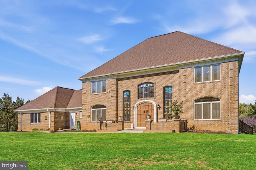 Nestled in the heart of Howard County, this exceptional estate offers a rare combination of privacy, space, and refined living on 7.5 beautifully landscaped acres. With 5 bedrooms, 4.5 baths, and over 7,056 square feet of living space, this home provides both comfort and a sense of grandeur throughout. Surrounded by nature, it feels like a peaceful retreat while still being located in one of the most desirable areas known for its highly rated 9-9-10 schools. No HOA! 

From the moment you arrive, you will be struck by the stunning handcrafted woodwork in the grand foyer, which continues up the staircase and into the living areas. Adding to its uniqueness, the foyer features one of a kind stained glass window artwork that creates a warm and elegant first impression. The level of detail and craftsmanship throughout the home truly stands out.

The land itself offers incredible flexibility. Whether you have been dreaming of keeping horses, raising livestock, adding a pool, or simply enjoying your own private outdoor space, this property gives you the opportunity to do it all.

Inside, the home offers bright and spacious living areas that are perfect for both everyday living and entertaining. The kitchen has been updated with quartz countertops, most of the bathrooms have been improved, and the home has been freshly painted. The floors have also been sanded and refinished, giving the home a clean and move in ready feel.

One of the highlights is the large deck, approximately 20 by 50 feet, set within the private backyard. It is an ideal space for gatherings, cookouts, and simply enjoying meals outdoors while taking in the peaceful surroundings.

The fully finished lower level adds even more versatility, including two additional rooms that can be used as a home office, gym, or whatever best fits your lifestyle. A three car garage provides plenty of space for parking and storage.

You will truly appreciate the sense of privacy this property offers, all while being in a prime location within Howard County known for its convenience and excellent schools.

This is a rare opportunity to own a home that combines space, character, and lifestyle in a truly special setting.